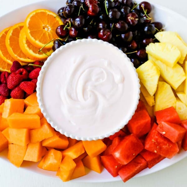Fruit Dip Creamy, fluffy fruit dip made with cream cheese, sweetened condensed milk, homemade whipped cream, and a touch of cherry juice. The best fruit dip recipe! www.modernhoney.com #fruitdip #creamyfruitdip #creamcheesedip