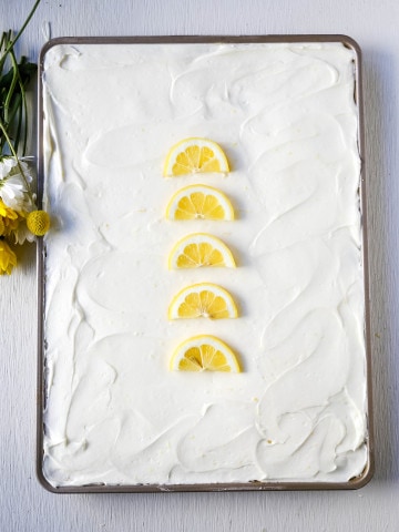 Lemon Sheet Cake Recipe. Moist sour cream lemon sheet cake recipe with a fresh lemon cream cheese frosting. #lemonsheetcake #cake