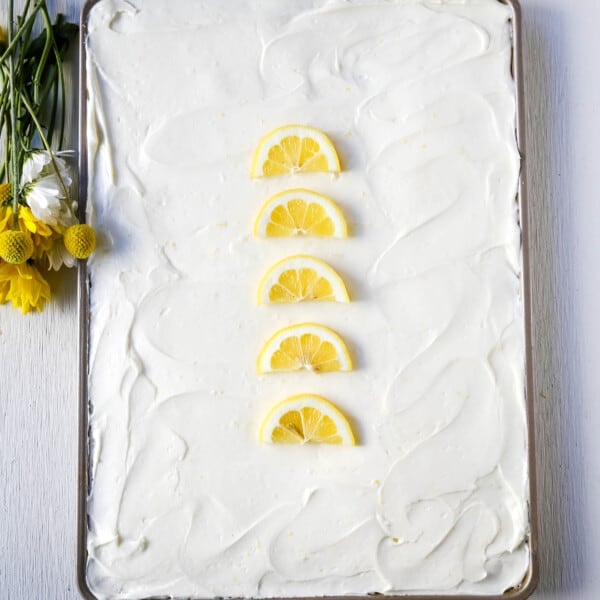 Lemon Sheet Cake Recipe. Moist sour cream lemon sheet cake recipe with a fresh lemon cream cheese frosting. #lemonsheetcake #cake