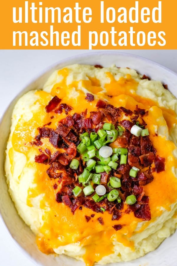 Loaded Mashed Potatoes. Creamy buttery mashed potatoes with sour cream, cheddar cheese, crispy bacon, and green onions. The perfect flavorful side dish that everyone loves! #mashedpotatoes #loadedmashedpotatoes #potatoes #sidedish