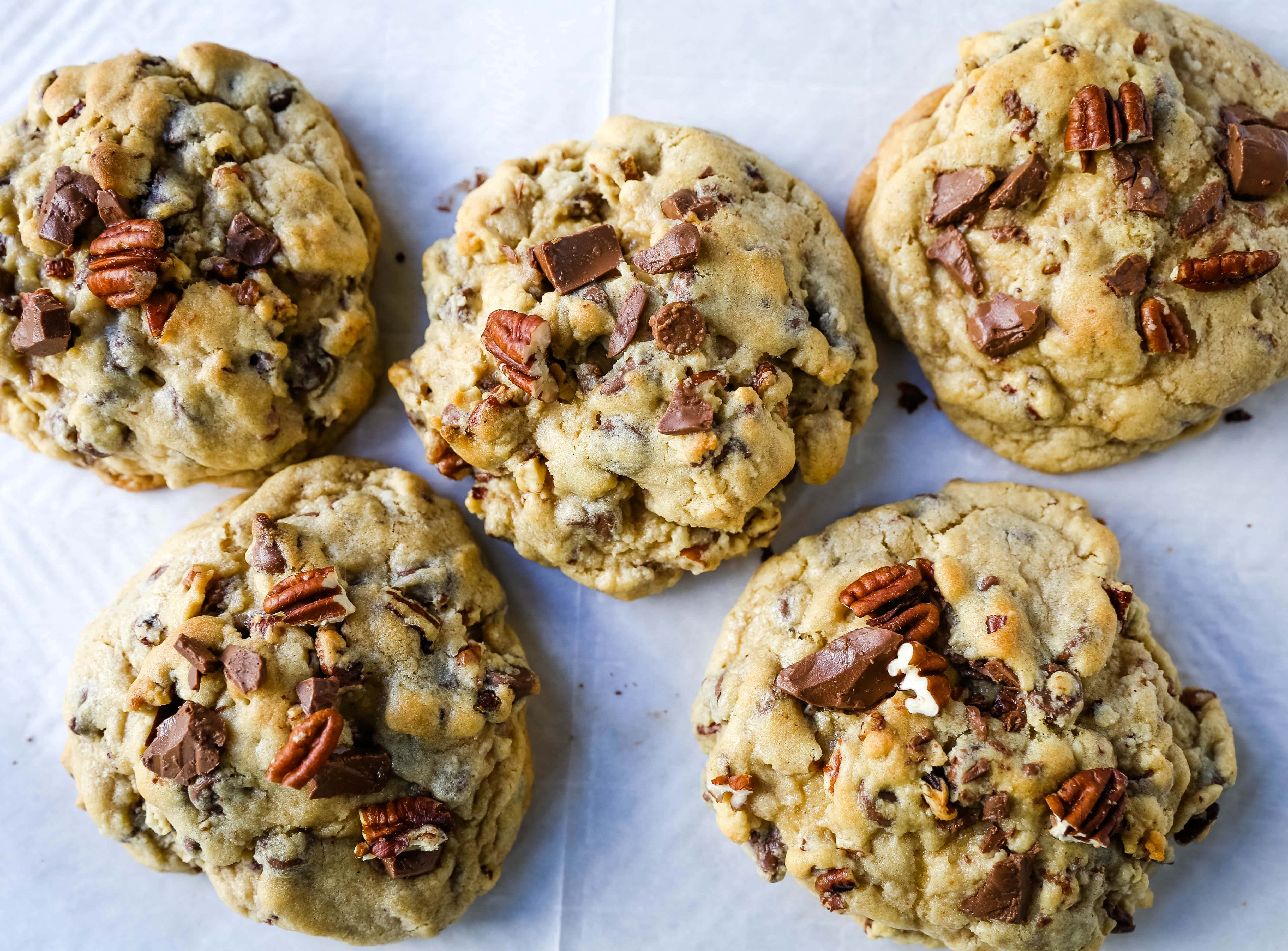 Bakery-Style Milk Chocolate Pecan Cookies. The best chocolate chip pecan cookie recipe. How to make perfect bakery style chocolate chip cookies. X-large cookie recipe. www.modernhoney.com