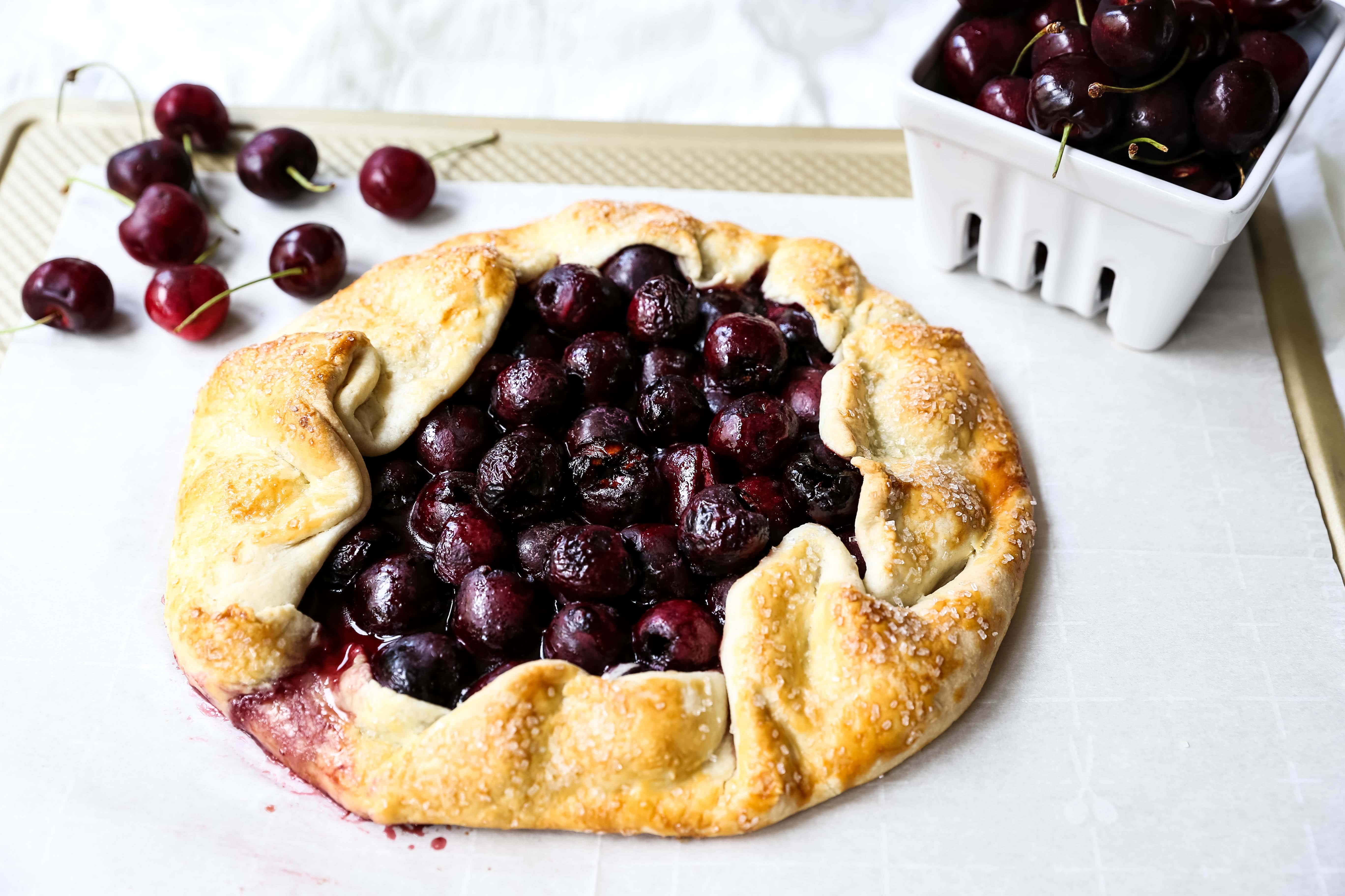 Cherry Galette. Fresh sweet cherries baked in a homemade rustic pie crust and topped with vanilla bean ice cream. The Best Cherry Crostata Recipe. www.modernhoney.com #cherrygalette #cherrycrostata #cherries #cherry #cherrydessert