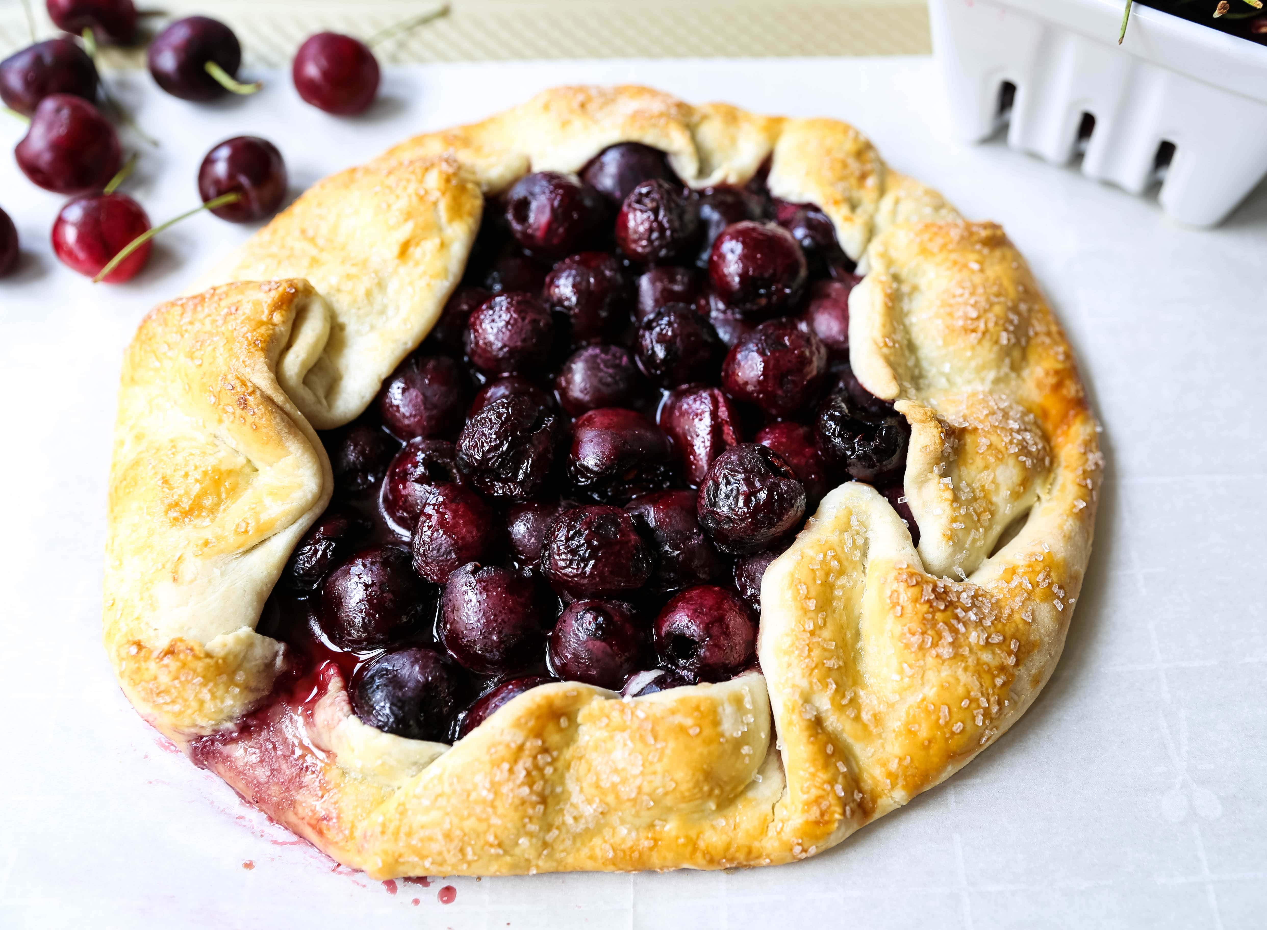 Cherry Galette. Fresh sweet cherries baked in a homemade rustic pie crust and topped with vanilla bean ice cream. The Best Cherry Crostata Recipe. www.modernhoney.com #cherrygalette #cherrycrostata #cherries #cherry #cherrydessert