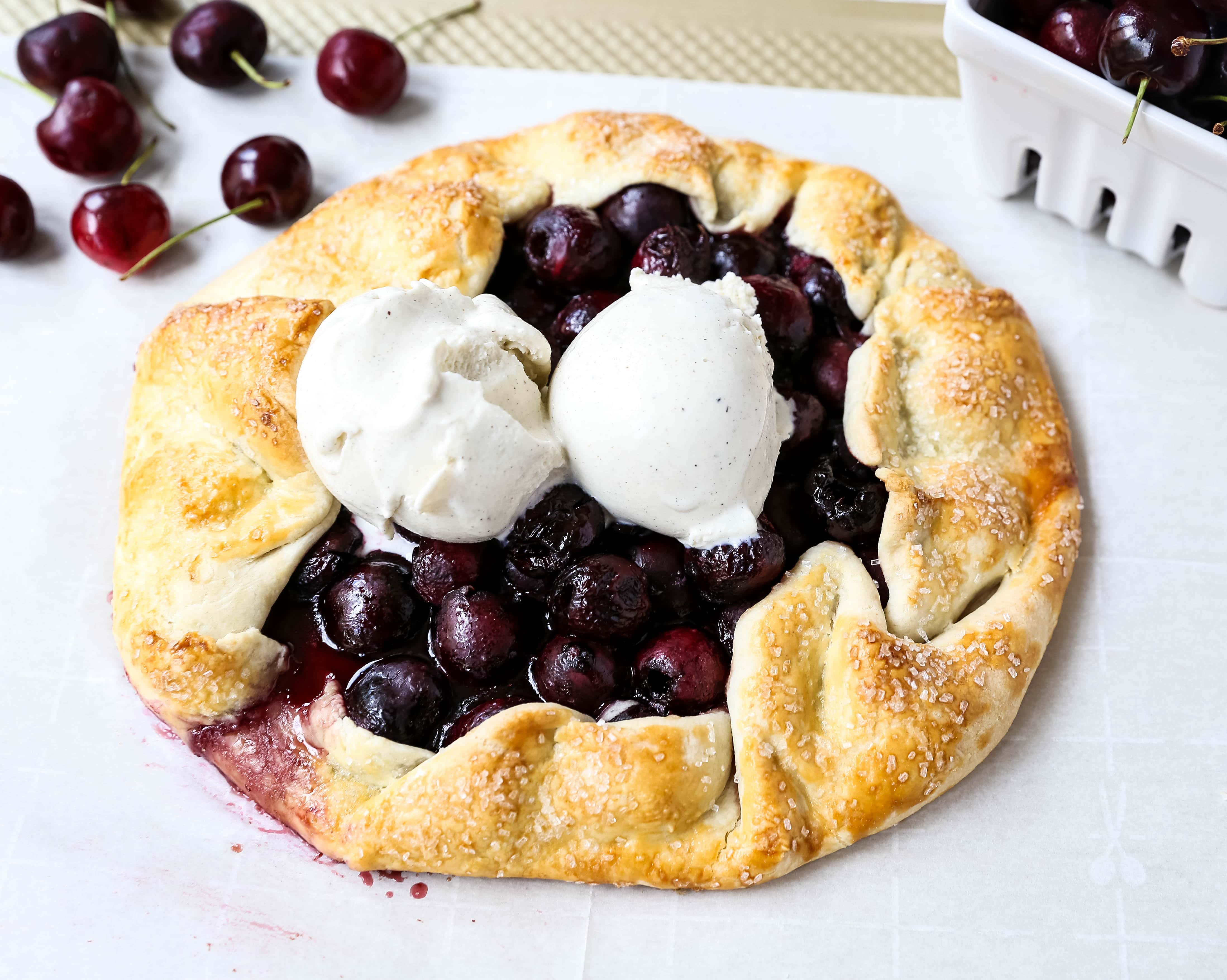 Cherry Galette. Fresh sweet cherries baked in a homemade rustic pie crust and topped with vanilla bean ice cream. The Best Cherry Crostata Recipe. www.modernhoney.com #cherrygalette #cherrycrostata #cherries #cherry #cherrydessert 