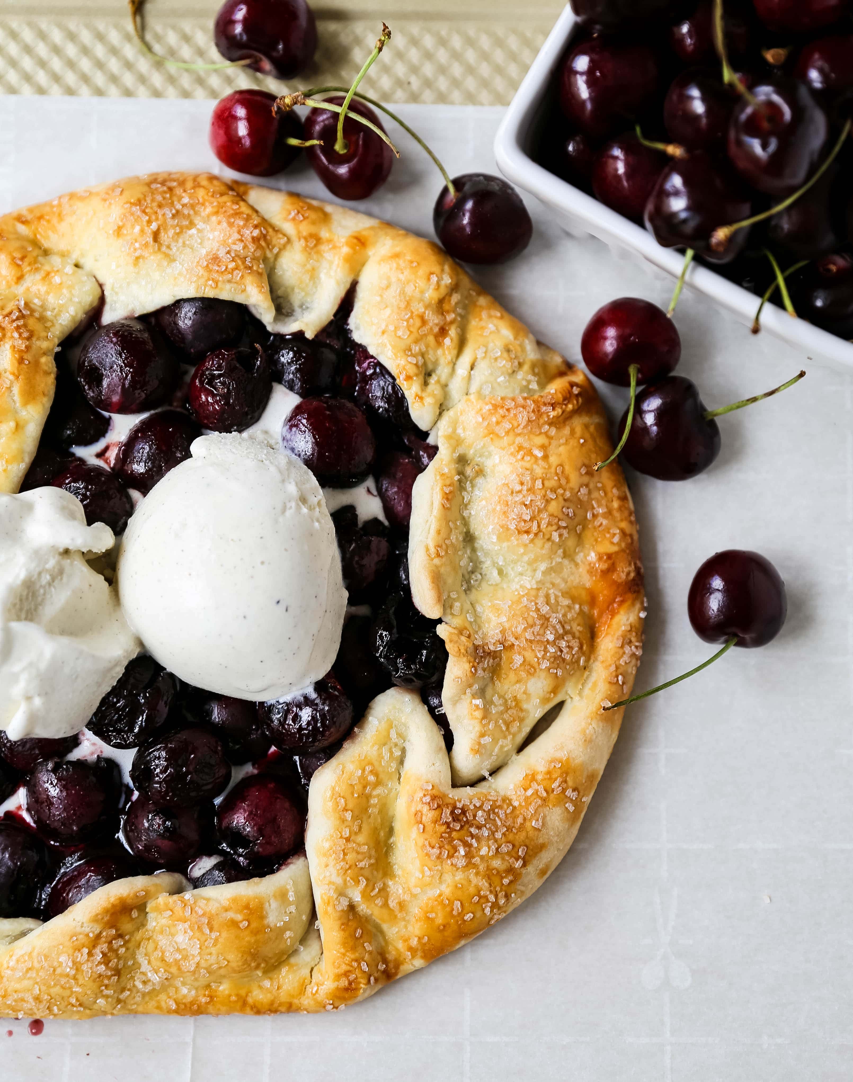 Cherry Galette. Fresh sweet cherries baked in a homemade rustic pie crust and topped with vanilla bean ice cream. The Best Cherry Crostata Recipe. www.modernhoney.com #cherrygalette #cherrycrostata #cherries #cherry #cherrydessert