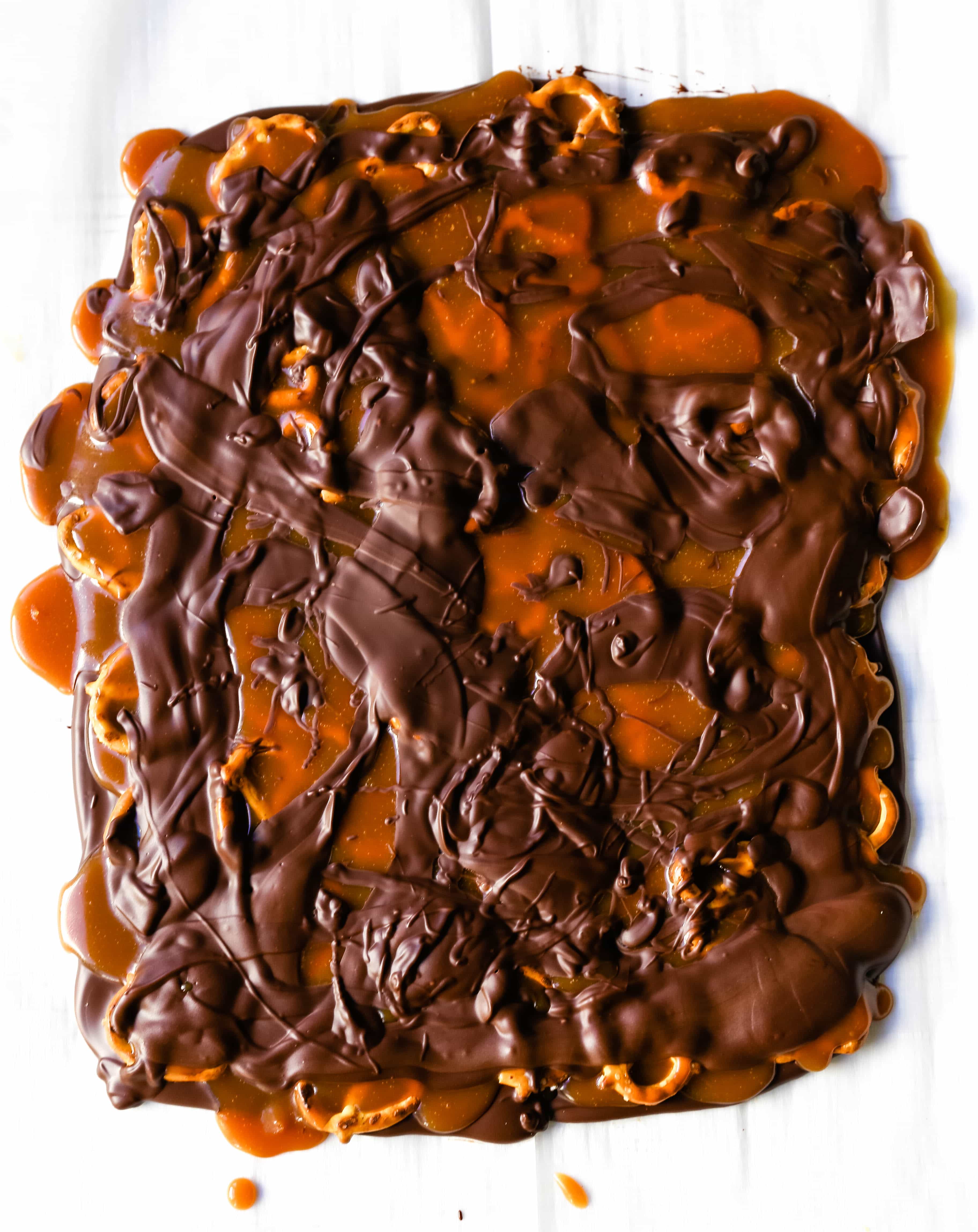 Chocolate Caramel Pretzel Bark. An easy homemade chocolate candy treat made with homemade salted caramel, salty pretzels, and creamy milk and semi-sweet chocolate. The perfect salty sweet combination! www.modernhoney.com #chocolatebark #pretzelbark #chocolatepretzelbark