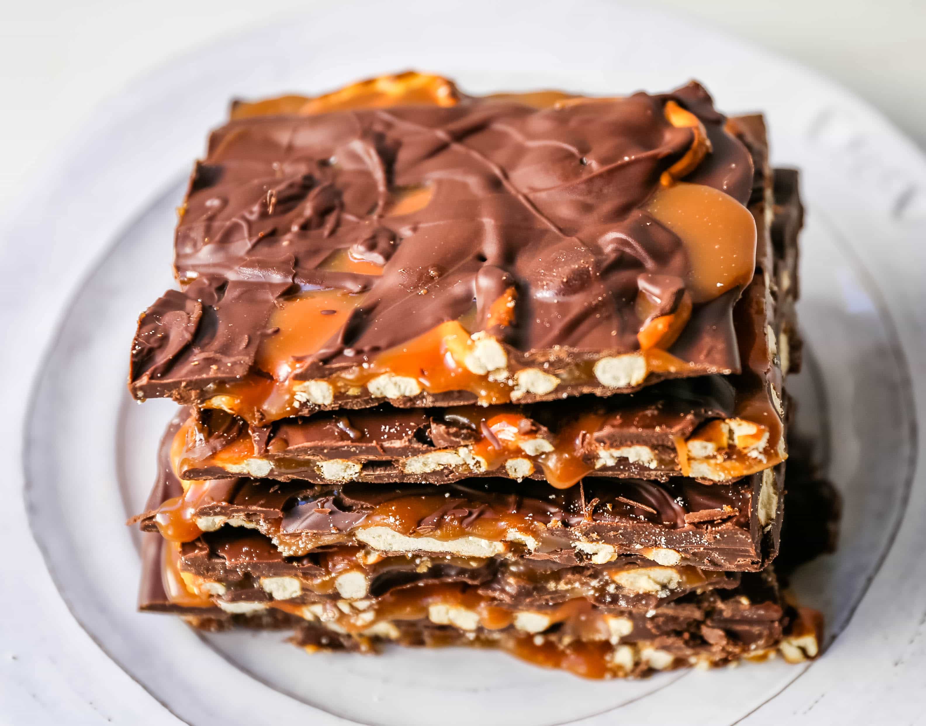 Chocolate Caramel Pretzel Bark. An easy homemade chocolate candy treat made with homemade salted caramel, salty pretzels, and creamy milk and semi-sweet chocolate. The perfect salty sweet combination! www.modernhoney.com #chocolatebark #pretzelbark #chocolatepretzelbark