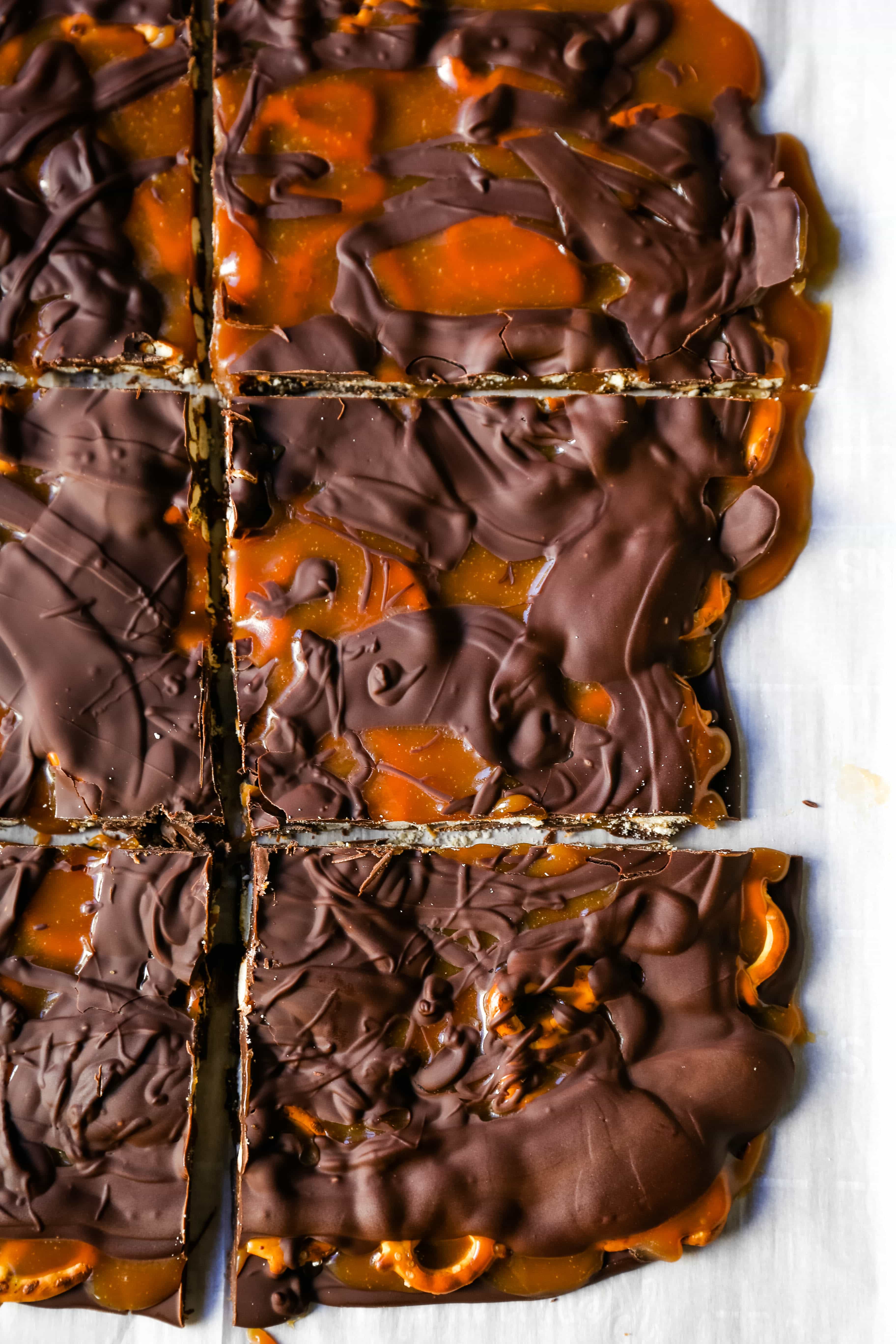 Chocolate Caramel Pretzel Bark. An easy homemade chocolate candy treat made with homemade salted caramel, salty pretzels, and creamy milk and semi-sweet chocolate. The perfect salty sweet combination! www.modernhoney.com #chocolatebark #pretzelbark #chocolatepretzelbark