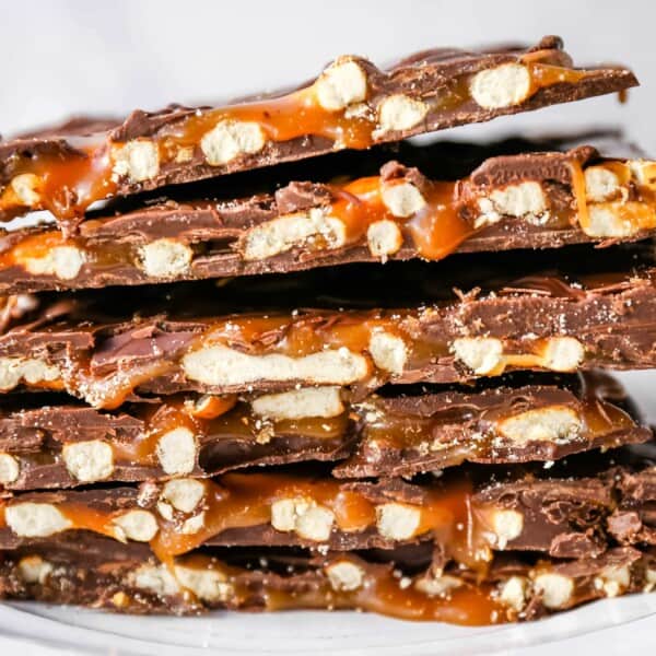 Chocolate Caramel Pretzel Bark. An easy homemade chocolate candy treat made with homemade salted caramel, salty pretzels, and creamy milk and semi-sweet chocolate. The perfect salty sweet combination! www.modernhoney.com #chocolatebark #pretzelbark #chocolatepretzelbark