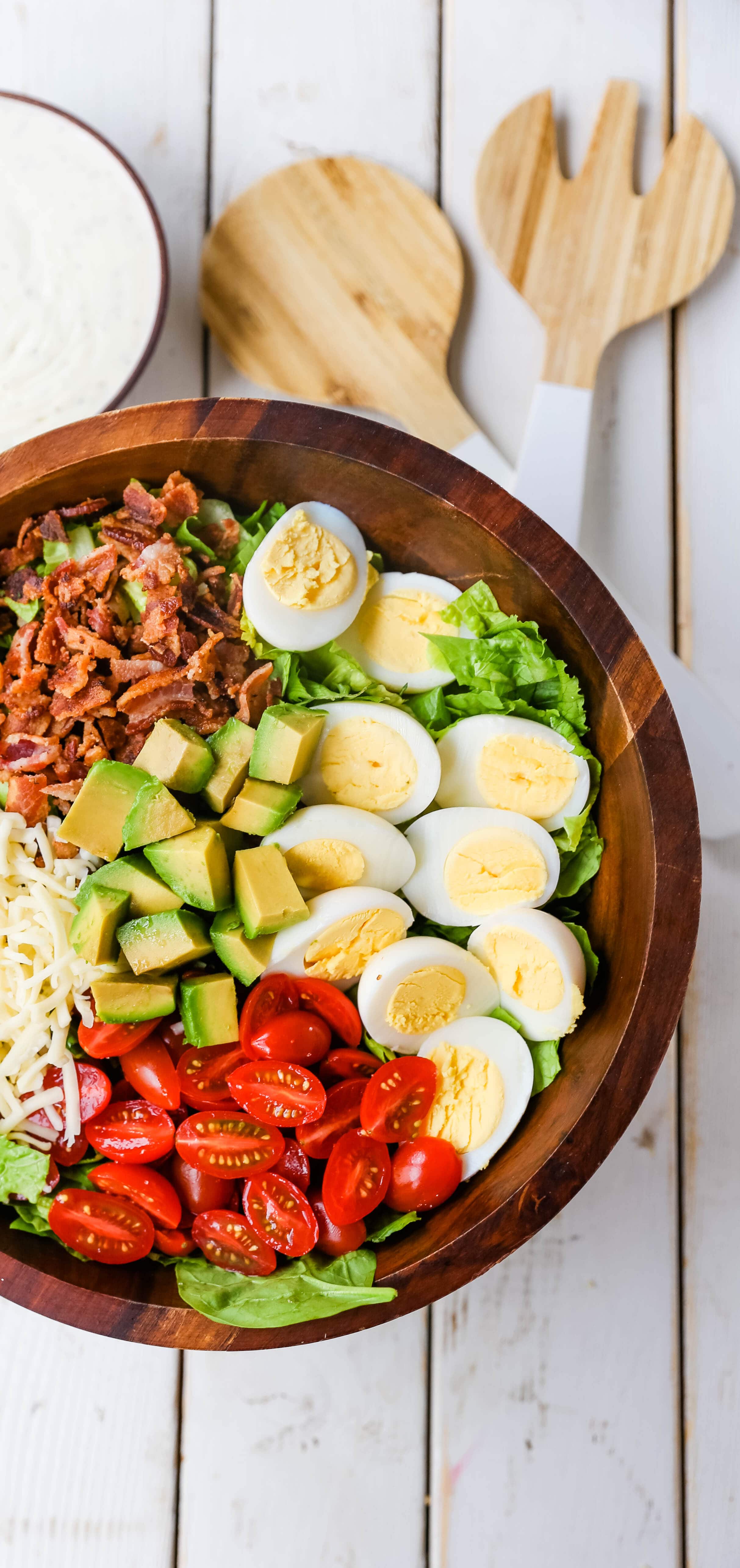 Cobb Salad made with romaine lettuce, crispy bacon, creamy avocado, juicy tomato, egg, Monterey Jack cheese, tossed in homemade Ranch dressing. www.modernhoney.com #salad #cobbsalad #salads