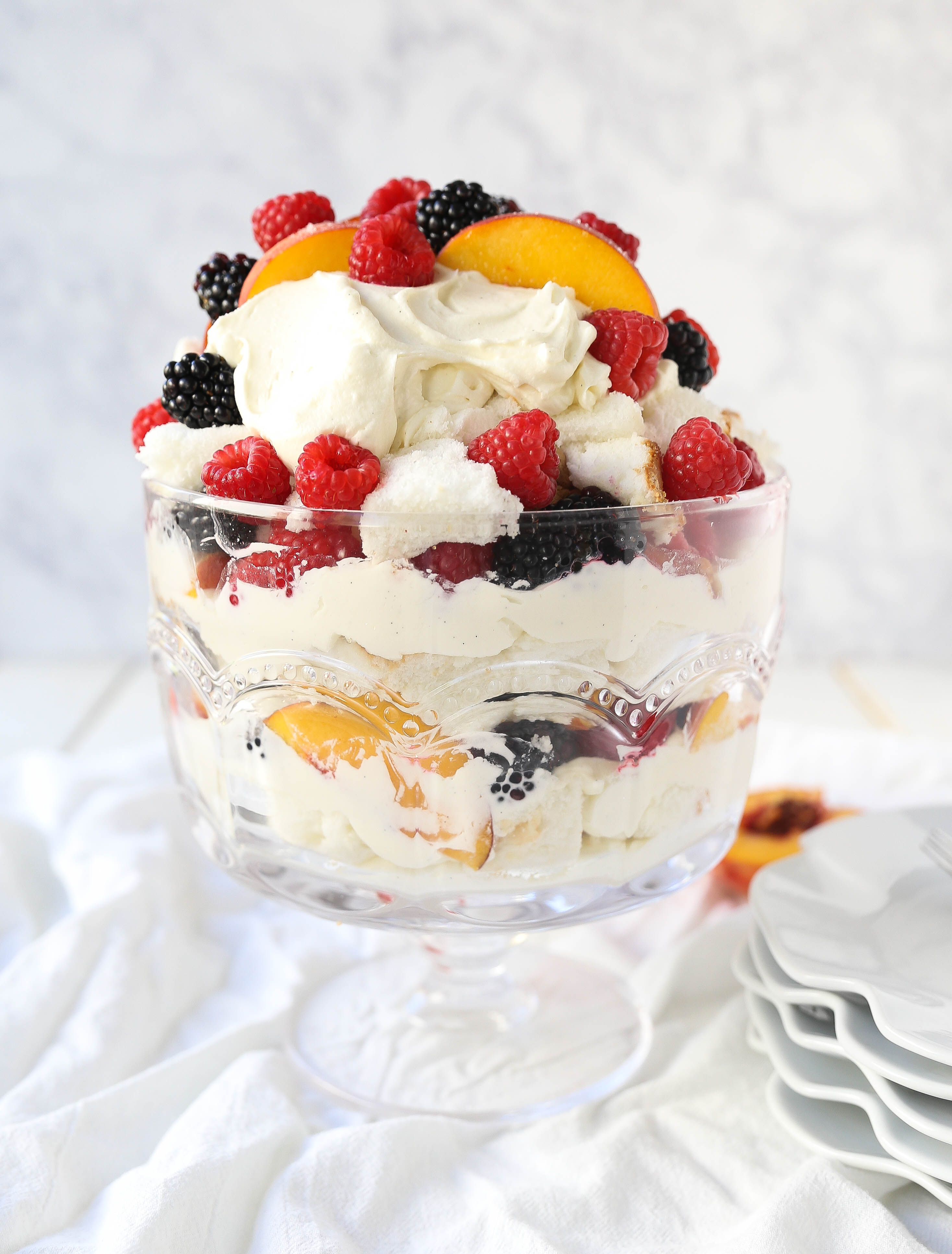 Peach Berry Trifle Angel food cake, a sweet, creamy, fluffy filling with fresh peaches and raspberries makes this the perfect summer dessert.  www.modernhoney.com #peach #peacherecipes #trifle #dessert