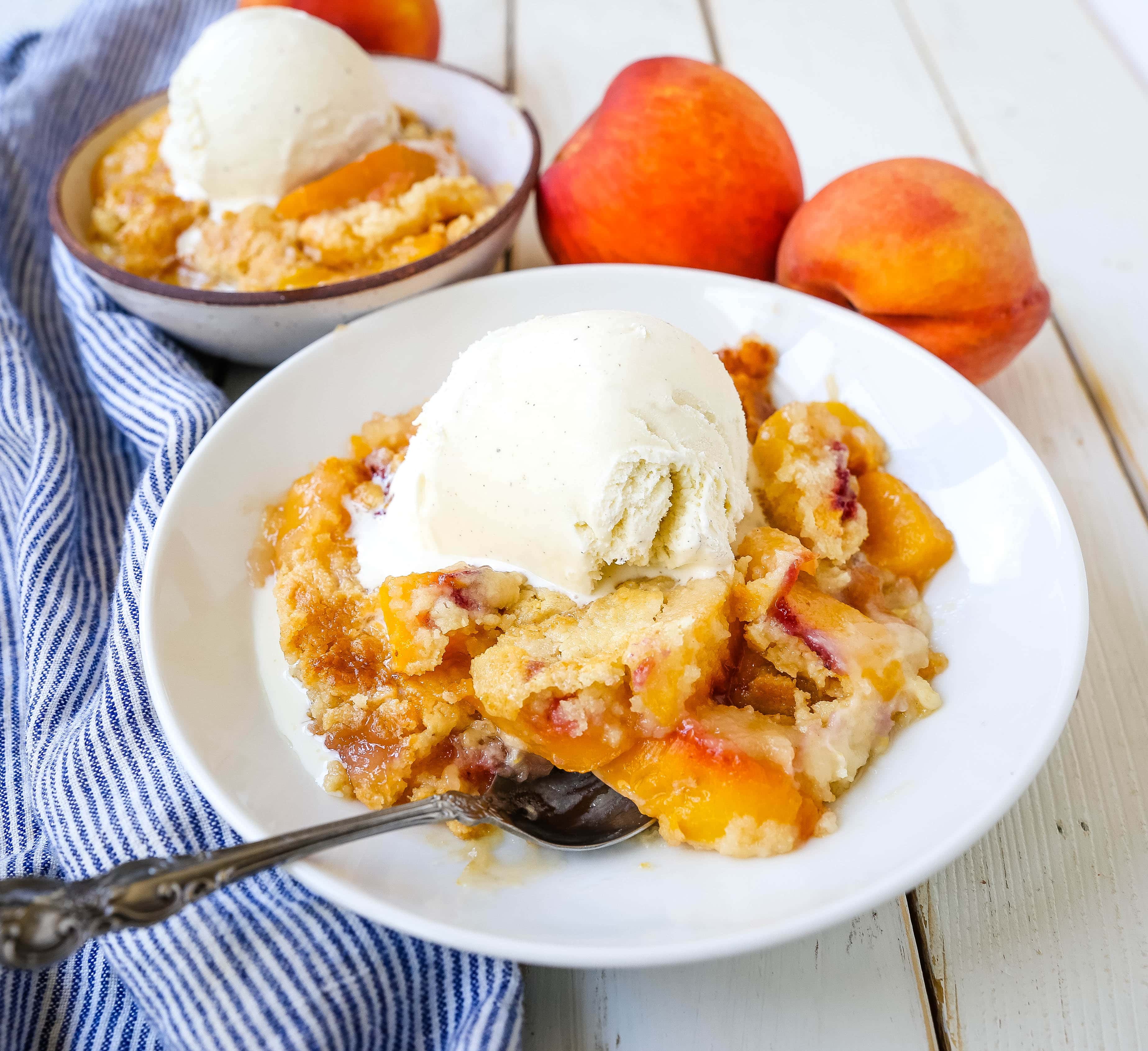 Peach Dump Cake The easiest 4-ingredient peach dessert. Fresh peaches, a touch of sugar, French vanilla cake mix, and butter all baked until golden and topped with vanilla ice cream. The simplest peach cobbler dessert recipe! www.modernhoney.com #peach #peaches #peachdesserts #peachcobbler #peachdumpcake