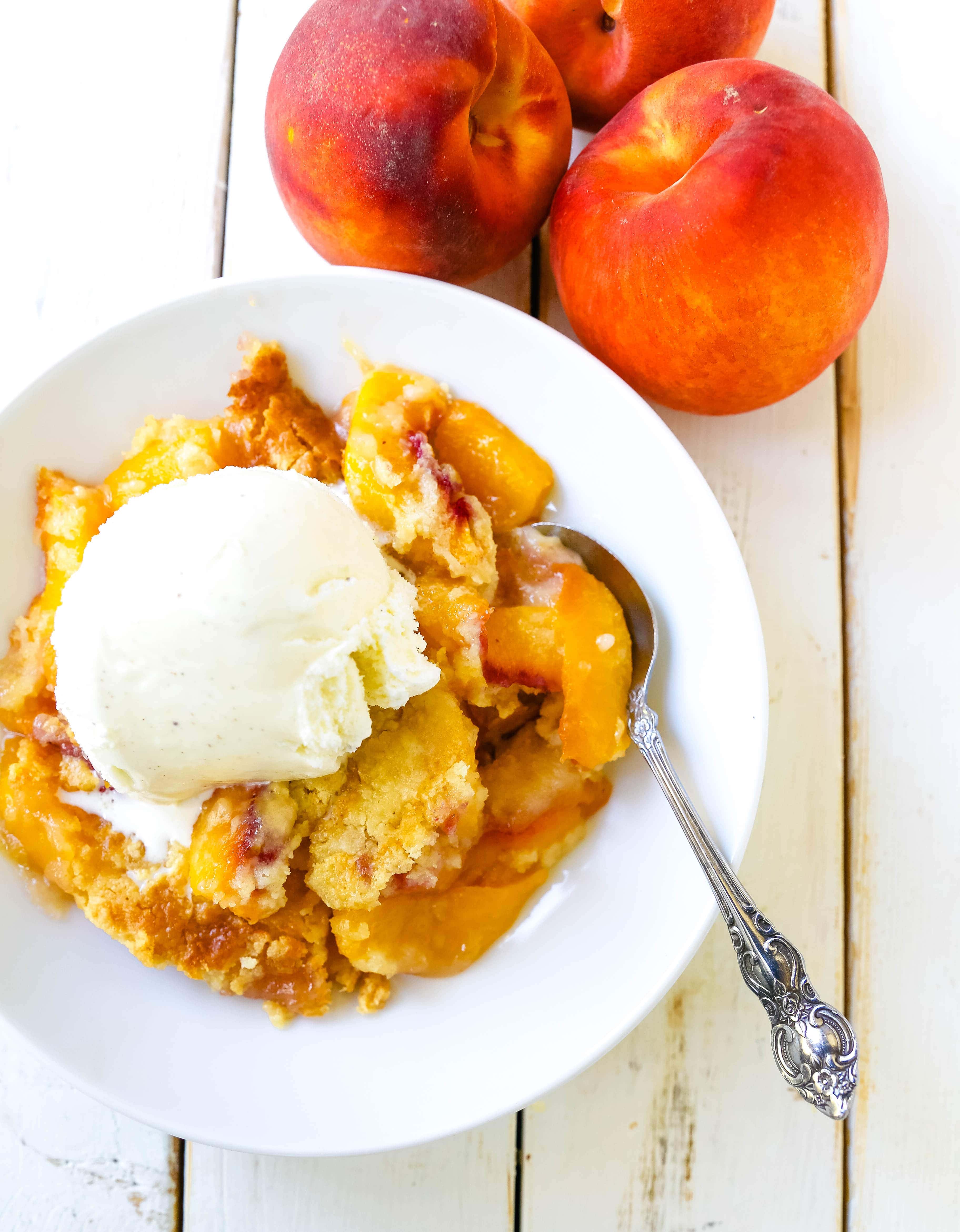 Peach Dump Cake The easiest 4-ingredient peach dessert. Fresh peaches, a touch of sugar, French vanilla cake mix, and butter all baked until golden and topped with vanilla ice cream. The simplest peach cobbler dessert recipe! www.modernhoney.com #peach #peaches #peachdesserts #peachcobbler #peachdumpcake