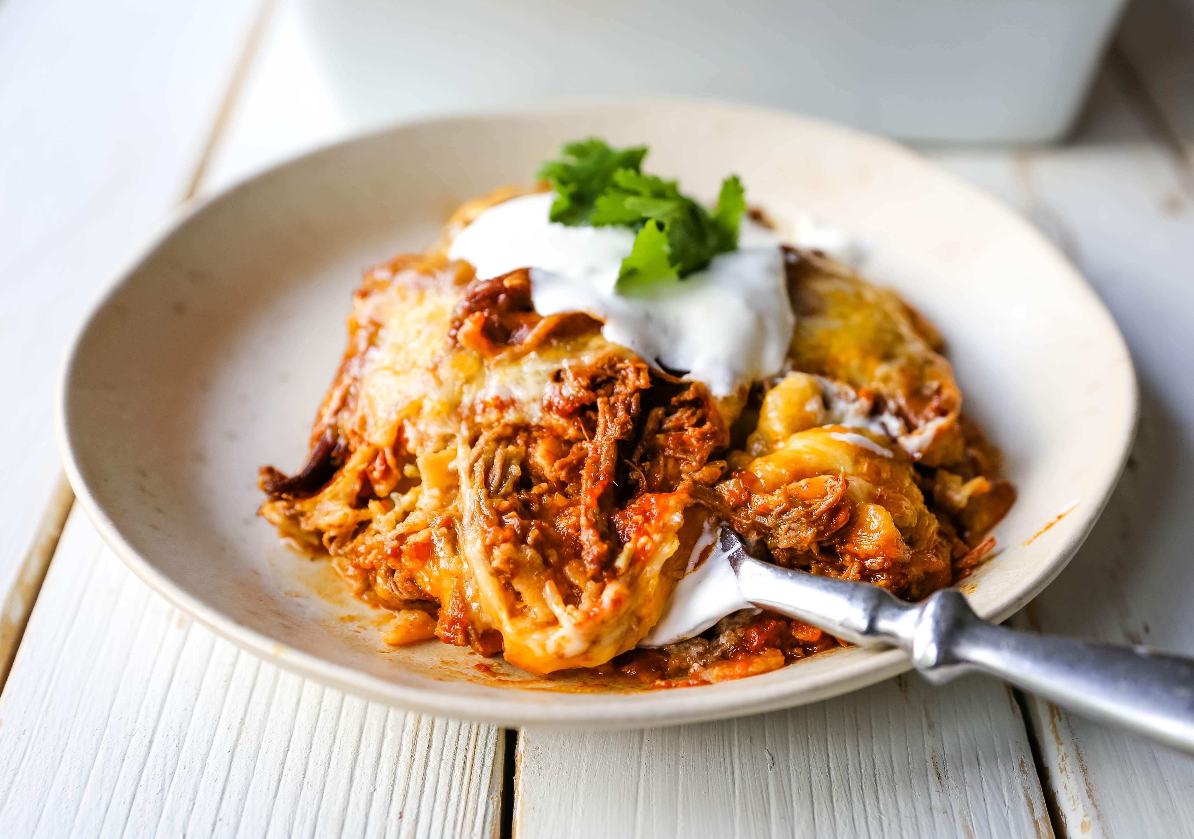 Stacked Beef Enchiladas. Mexican seasoned shredded beef enchiladas with melted cheese, corn tortillas, and homemade enchilada sauce. An easy beef enchilada casserole! #mexican #mexicanfood #enchiladas #beefenchiladas