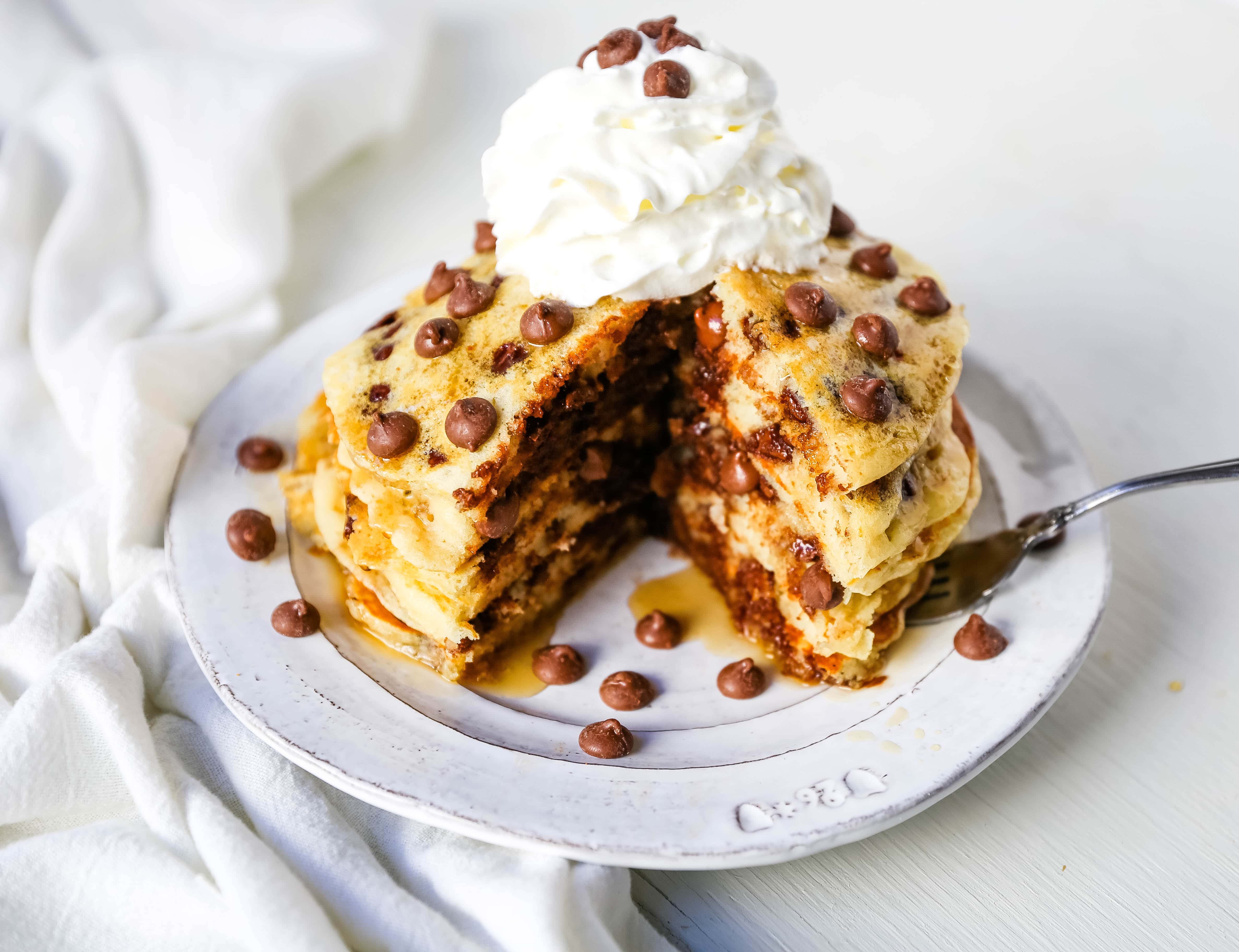 Chocolate Chip Pancakes The Best Homemade light, fluffy buttermilk pancakes with sweet milk chocolate chips. It makes the most decadent breakfast! www.modernhoney.com #pancakes #chocolatechippancakes #chocolatepancakes