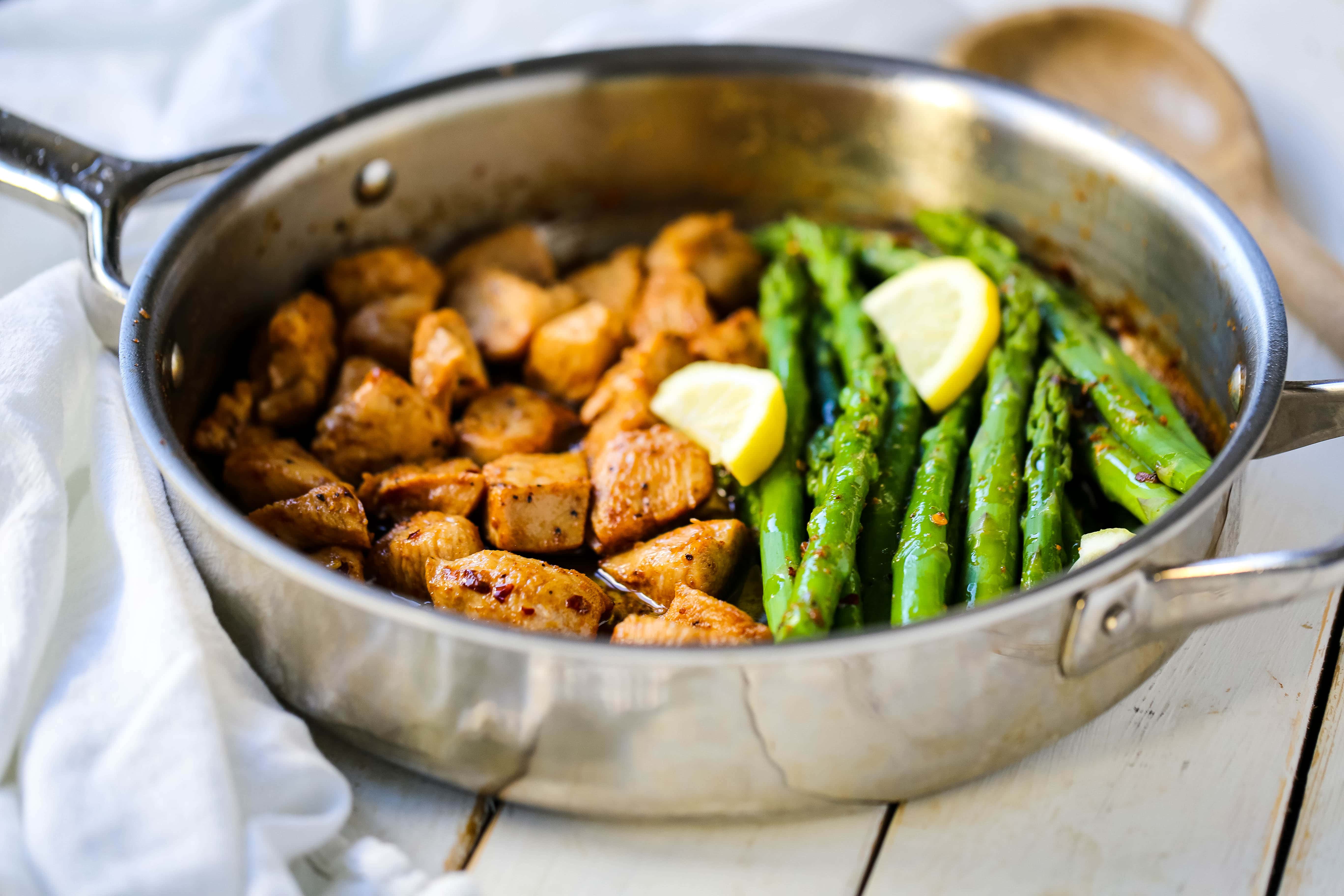 Garlic Butter Chicken and Asparagus Skillet A quick and easy one skillet dinner made with sautéed chicken and asparagus tossed in garlic butter. www.modernhoney.com #chicken #skilletdinner #chickendinner