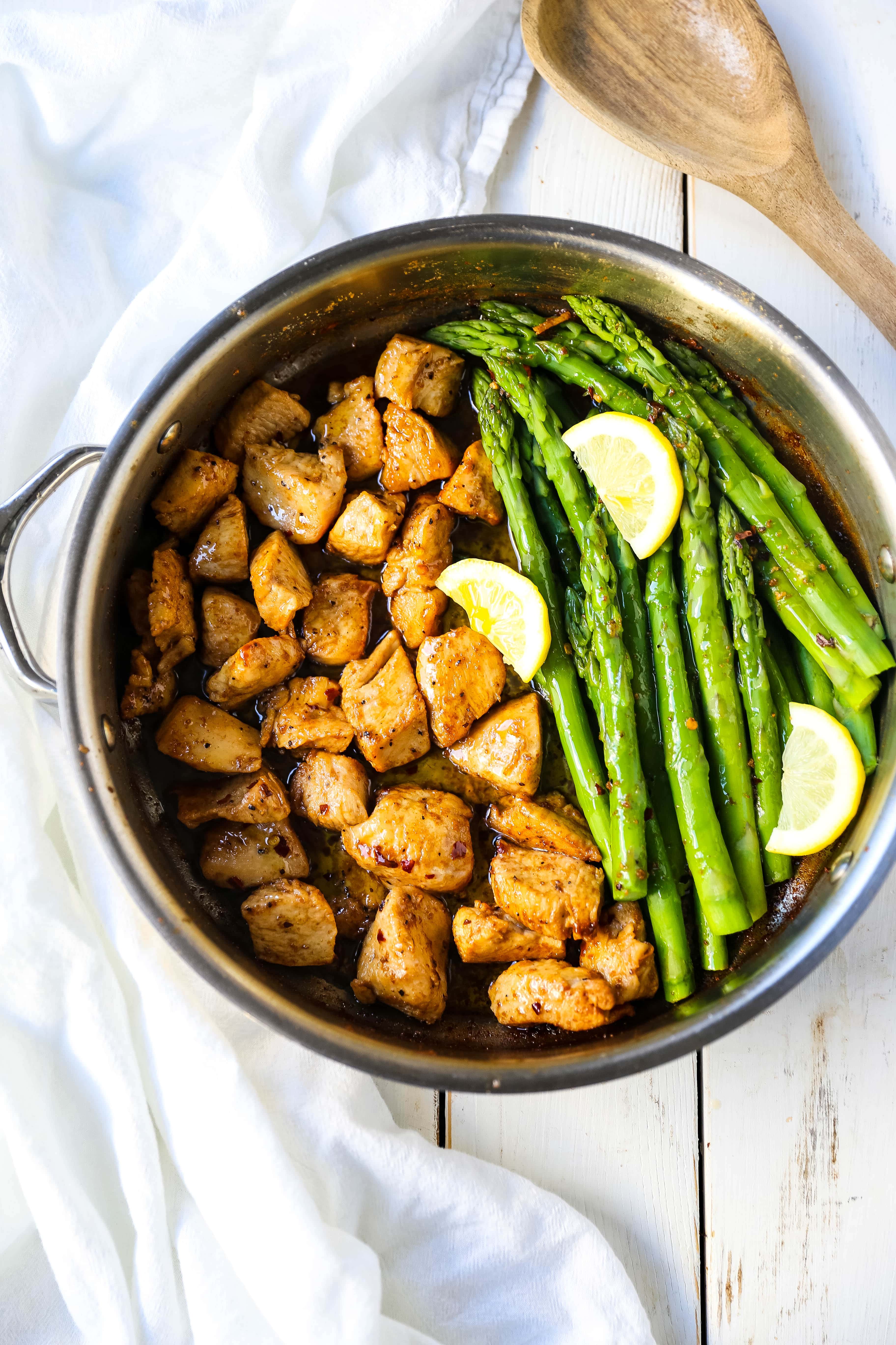 Garlic Butter Chicken and Asparagus Skillet A quick and easy one skillet dinner made with sautéed chicken and asparagus tossed in garlic butter. www.modernhoney.com #chicken #skilletdinner #chickendinner