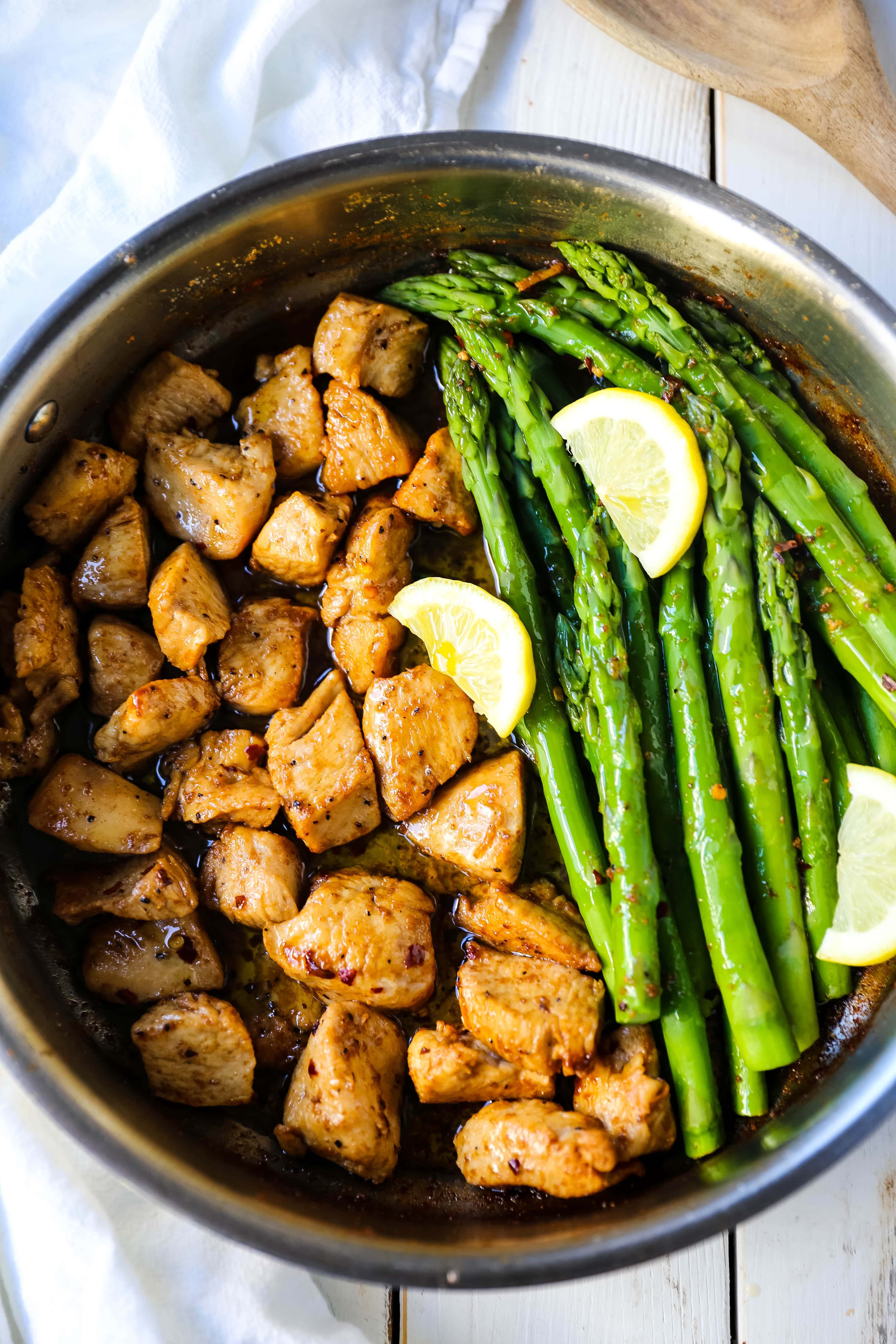 Garlic Butter Chicken and Asparagus Skillet A quick and easy one skillet dinner made with sautéed chicken and asparagus tossed in garlic butter. 