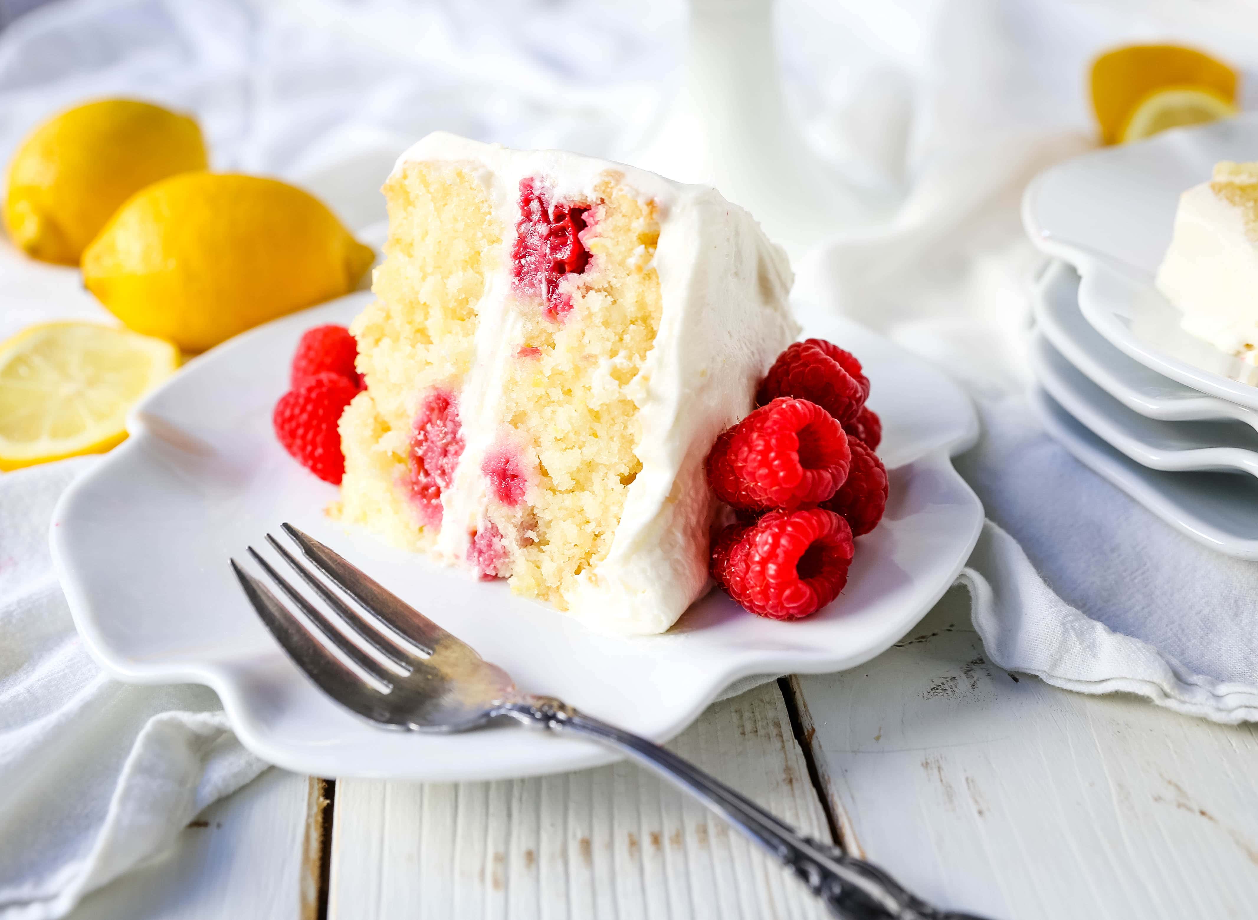 The Best Lemon Raspberry Cake. A light and fluffy lemon cake with fresh raspberries and a fresh lemon cream cheese frosting. A sweet and tangy lemon berry cake! #lemoncake #cake #lemonraspberrycake