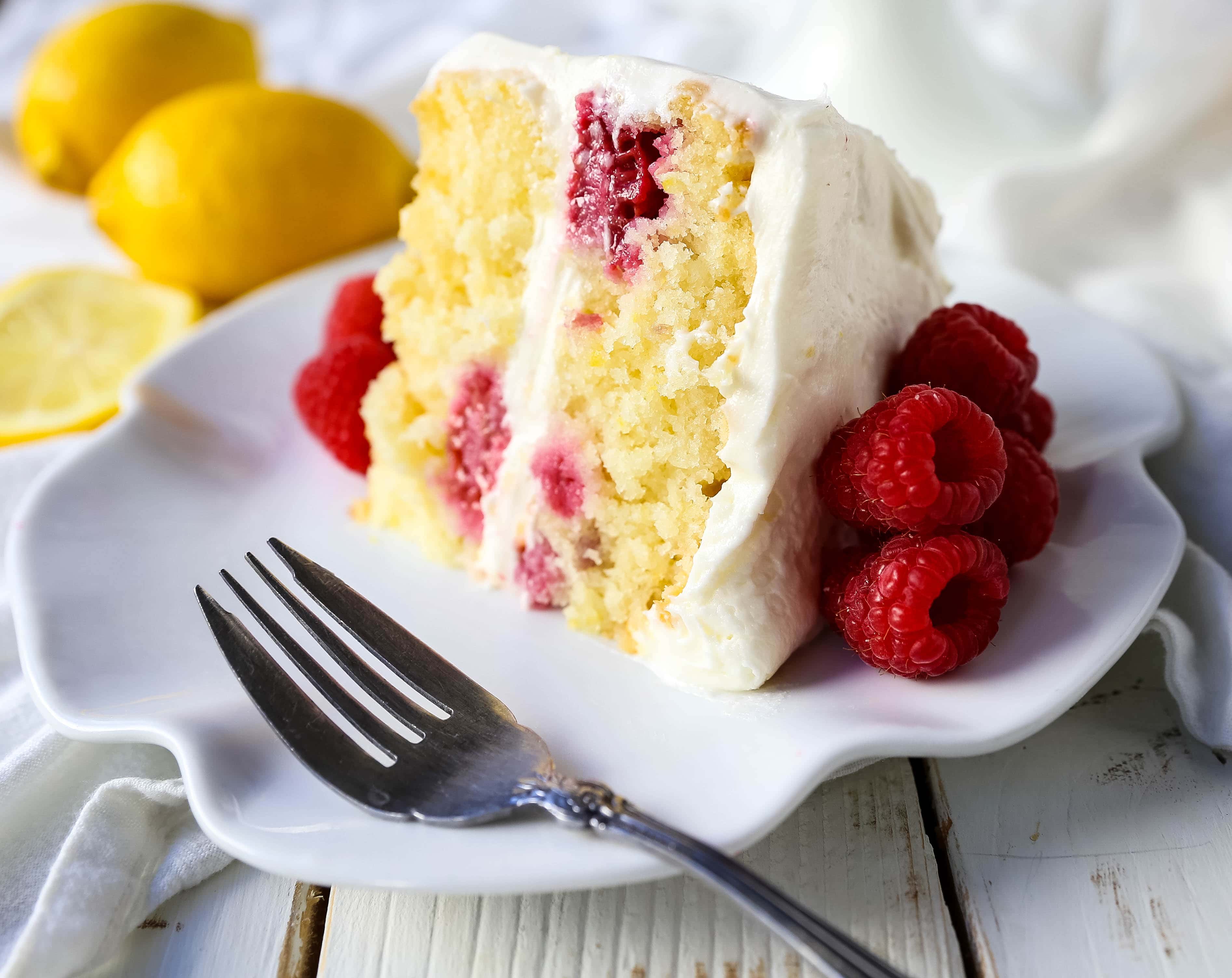 The Best Lemon Raspberry Cake. A light and fluffy lemon cake with fresh raspberries and a fresh lemon cream cheese frosting. A sweet and tangy lemon berry cake! #lemoncake #cake #lemonraspberrycake