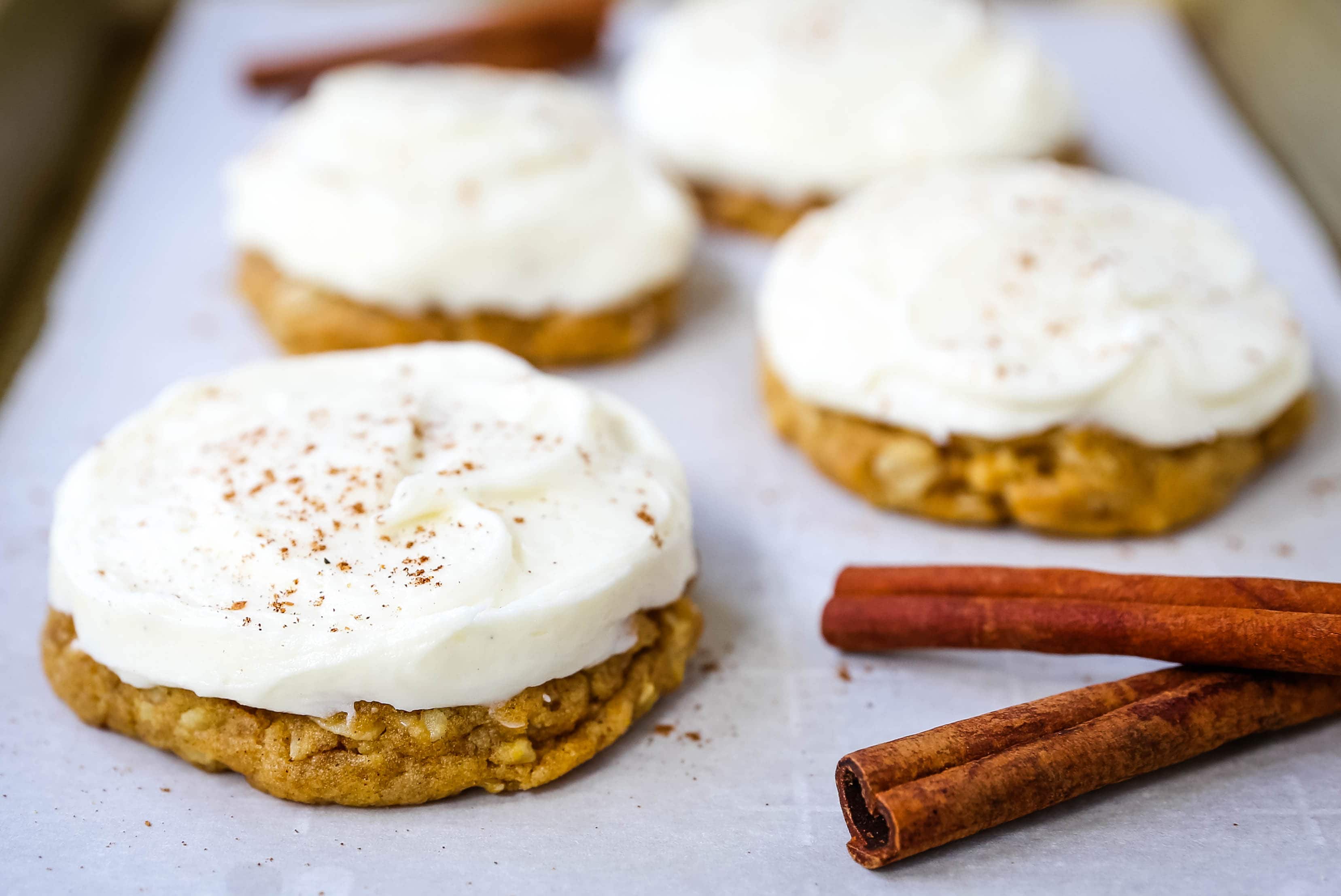 The BEST PUMPKIN COOKIES with CREAM CHEESE FROSTING Soft chewy pumpkin spiced cookies with a fluffy sweet cream cheese frosting. The perfect frosted pumpkin cookie recipe! www.modernhoney.com #pumpkin #pumpkincookies #frostedpumpkincookies #fall #fallrecipes