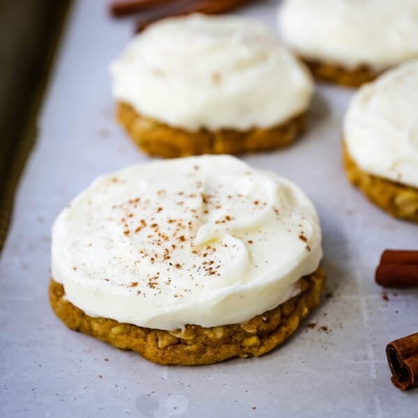 The BEST PUMPKIN COOKIES with CREAM CHEESE FROSTING Soft chewy pumpkin spiced cookies with a fluffy sweet cream cheese frosting. The perfect frosted pumpkin cookie recipe! www.modernhoney.com #pumpkin #pumpkincookies #frostedpumpkincookies #fall #fallrecipes