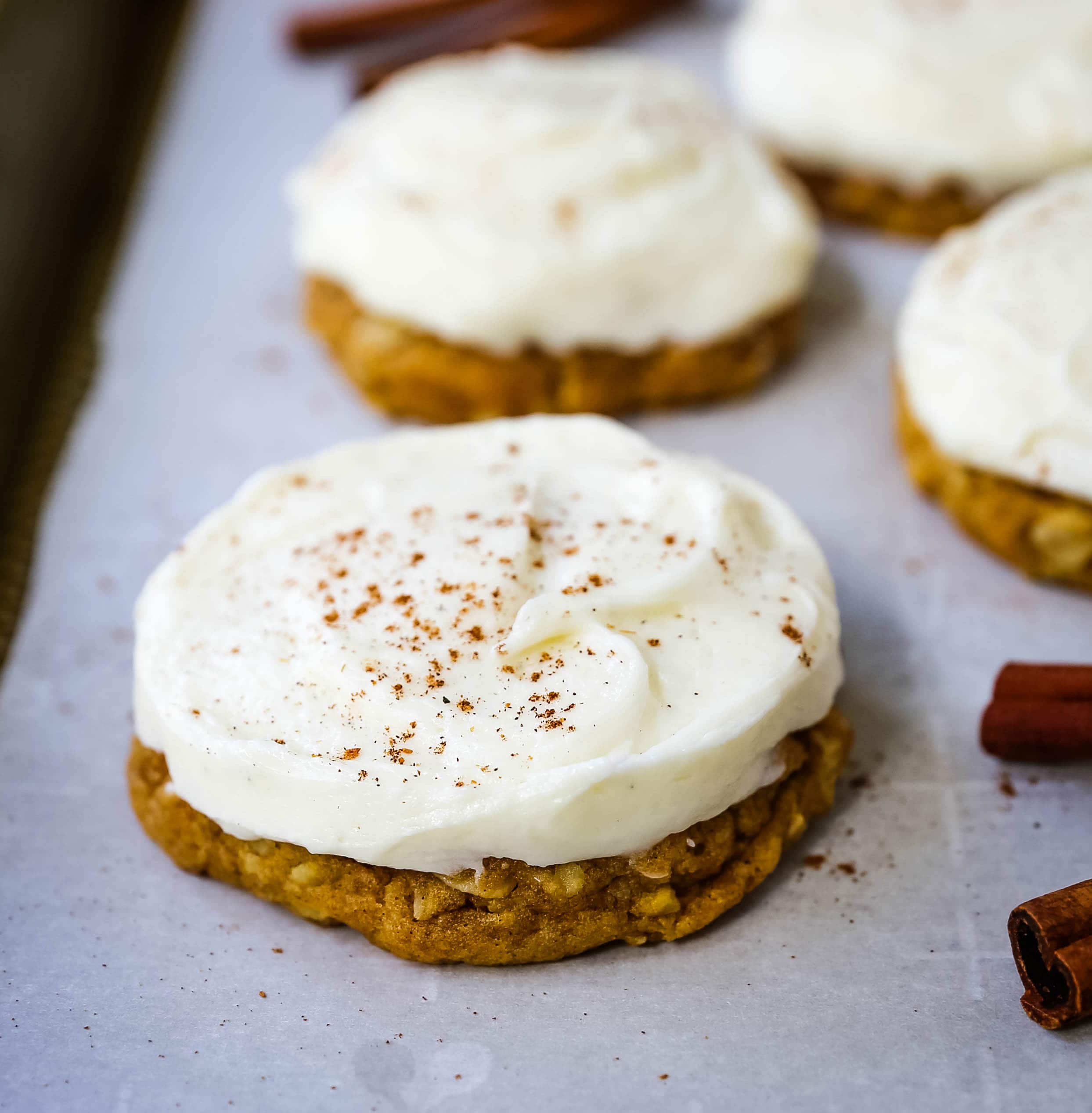 The BEST PUMPKIN COOKIES with CREAM CHEESE FROSTING Soft chewy pumpkin spiced cookies with a fluffy sweet cream cheese frosting. The perfect frosted pumpkin cookie recipe! www.modernhoney.com #pumpkin #pumpkincookies #frostedpumpkincookies #fall #fallrecipes