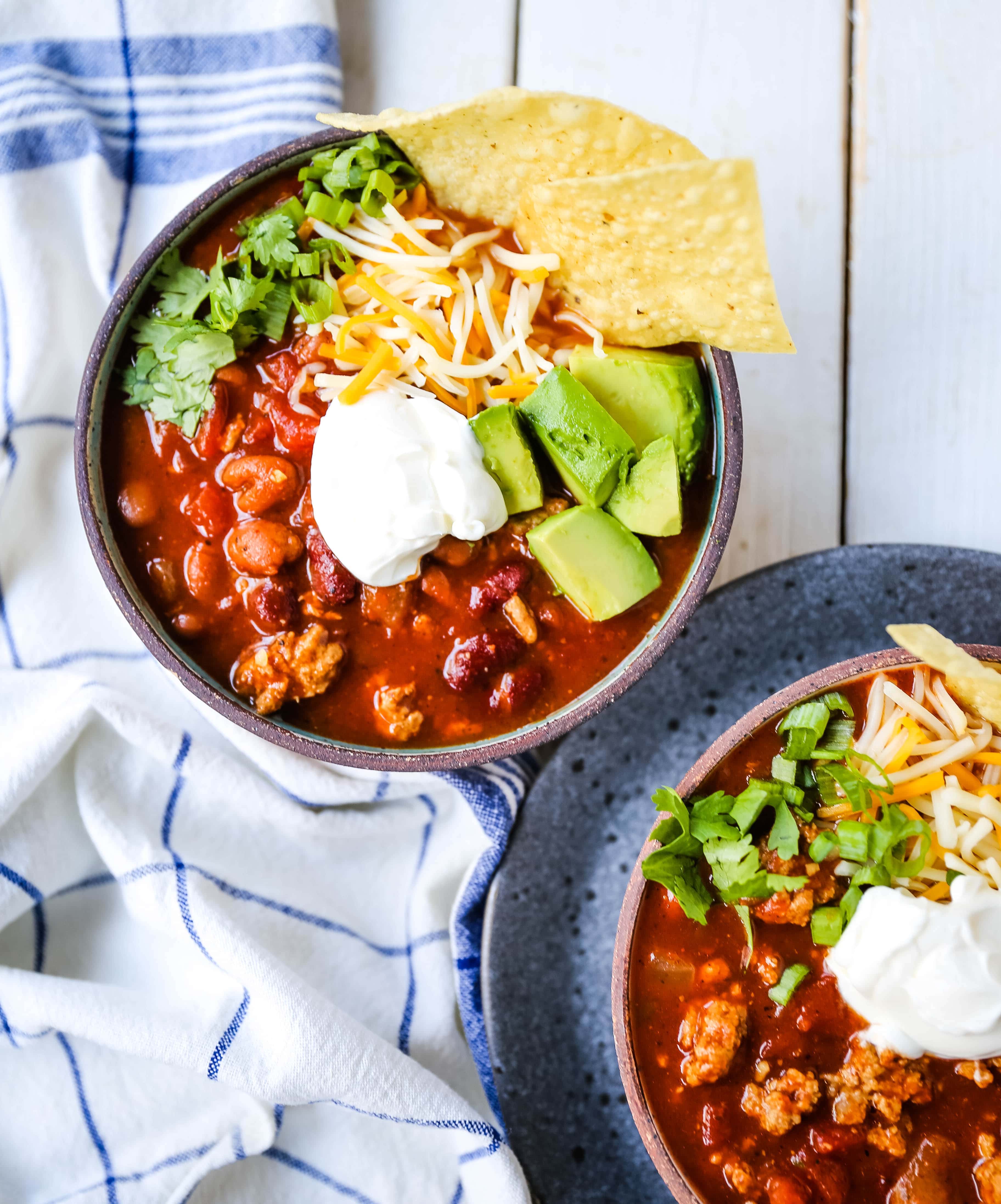 The Best Turkey Chili Recipe Lean Ground Turkey, Seasoned Chili Beans, Tomato sauce, Spices and a few secret ingredients make this the best turkey chili recipe ever! www.modernhoney.com #turkeychili #chilirecipe #fall #fallrecipes 