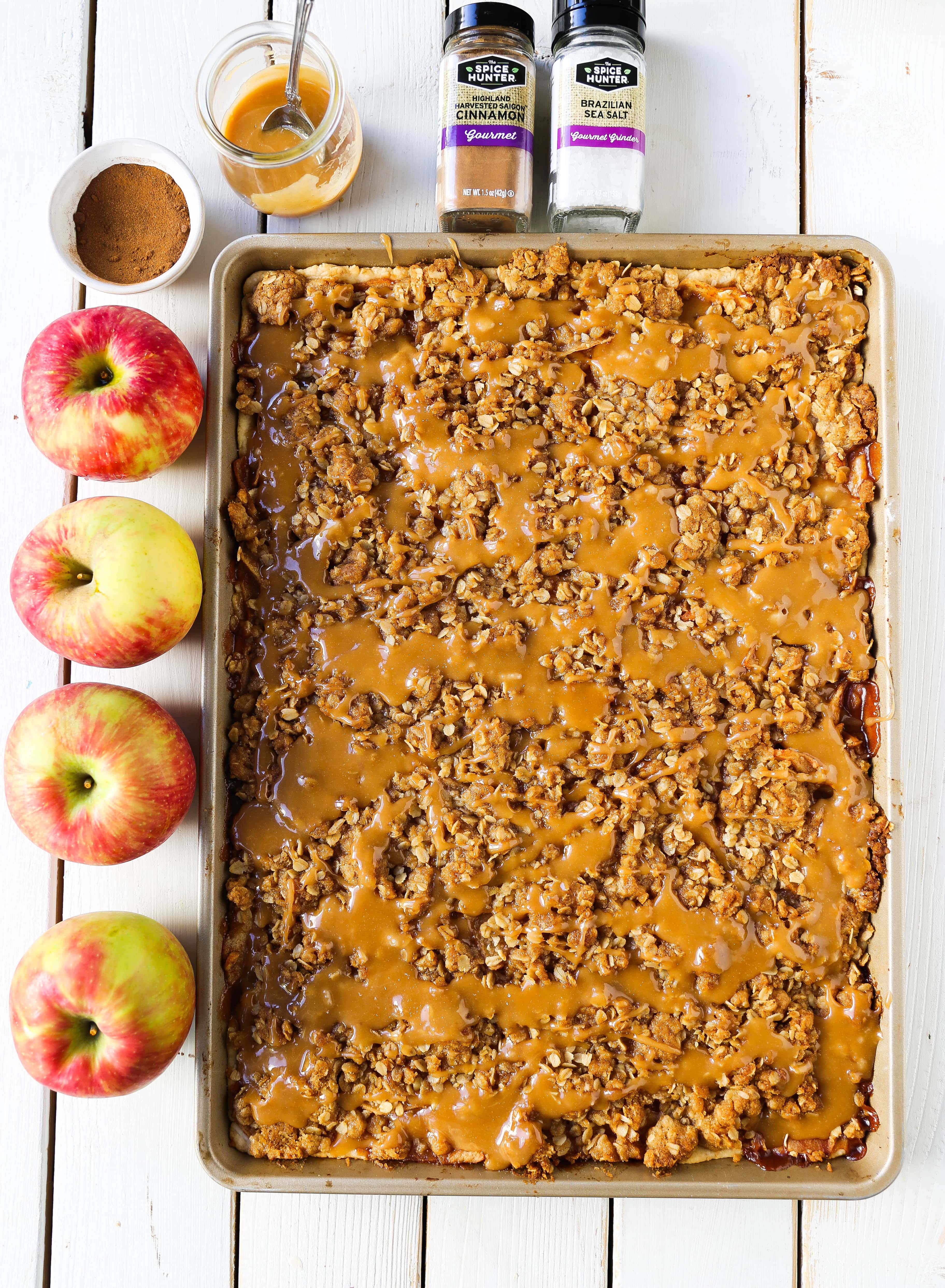 Caramel Apple Slab Pie Juicy cinnamon sugar apples baked in a flaky pie crust and topped with a buttery brown sugar crumb topping then drizzled with homemade salted caramel. An easy way to make apple pie to feed a crowd! www.modernhoney.com #applepie #apples #caramelapplepie #appleslabpie #slabpie