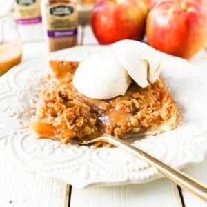 Caramel Apple Slab Pie Juicy cinnamon sugar apples baked in a flaky pie crust and topped with a buttery brown sugar crumb topping then drizzled with homemade salted caramel. An easy way to make apple pie to feed a crowd! www.modernhoney.com #applepie #apples #caramelapplepie #appleslabpie #slabpie