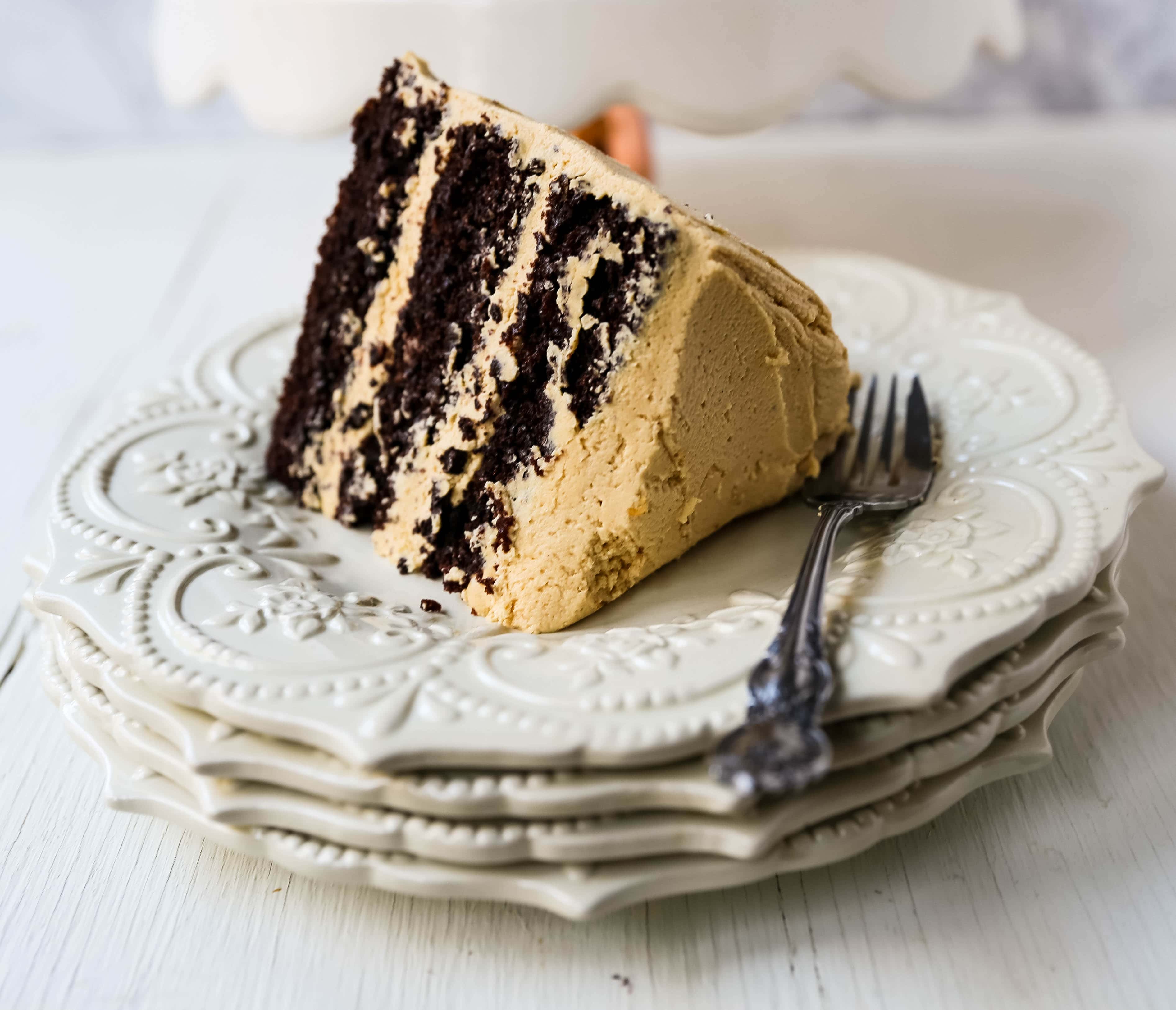 Chocolate Cake with Peanut Butter Frosting A moist 5-Star Rated Chocolate Cake with Creamy Peanut Butter Frosting topped with Peanut Butter Cups. www.modernhoney.com #peanutbutter #chocolatepeanutbuttercake #chocolatecake