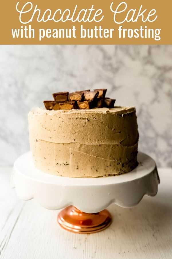 Chocolate Cake with Peanut Butter Frosting A moist 5-Star Rated Chocolate Cake with Creamy Peanut Butter Frosting topped with Peanut Butter Cups. www.modernhoney.com #peanutbutter #chocolatepeanutbuttercake #chocolatecake