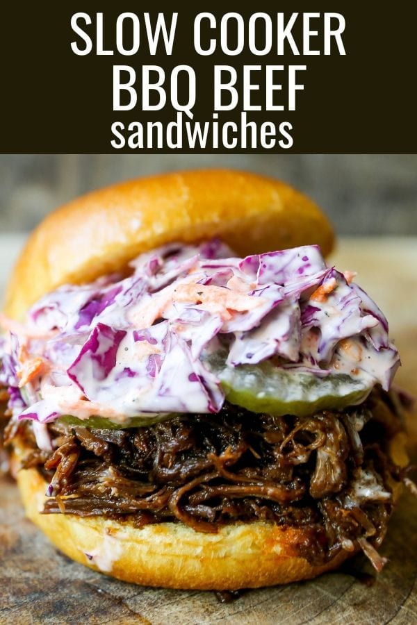 Slow Cooker BBQ Beef Sandwiches Tender seasoned slow cooked beef basted in BBQ sauce and sandwiched between brioche buns and topped with a crunchy coleslaw. www.modernhoney.com #bbqbeef #bbq #crockpot #slowcooker