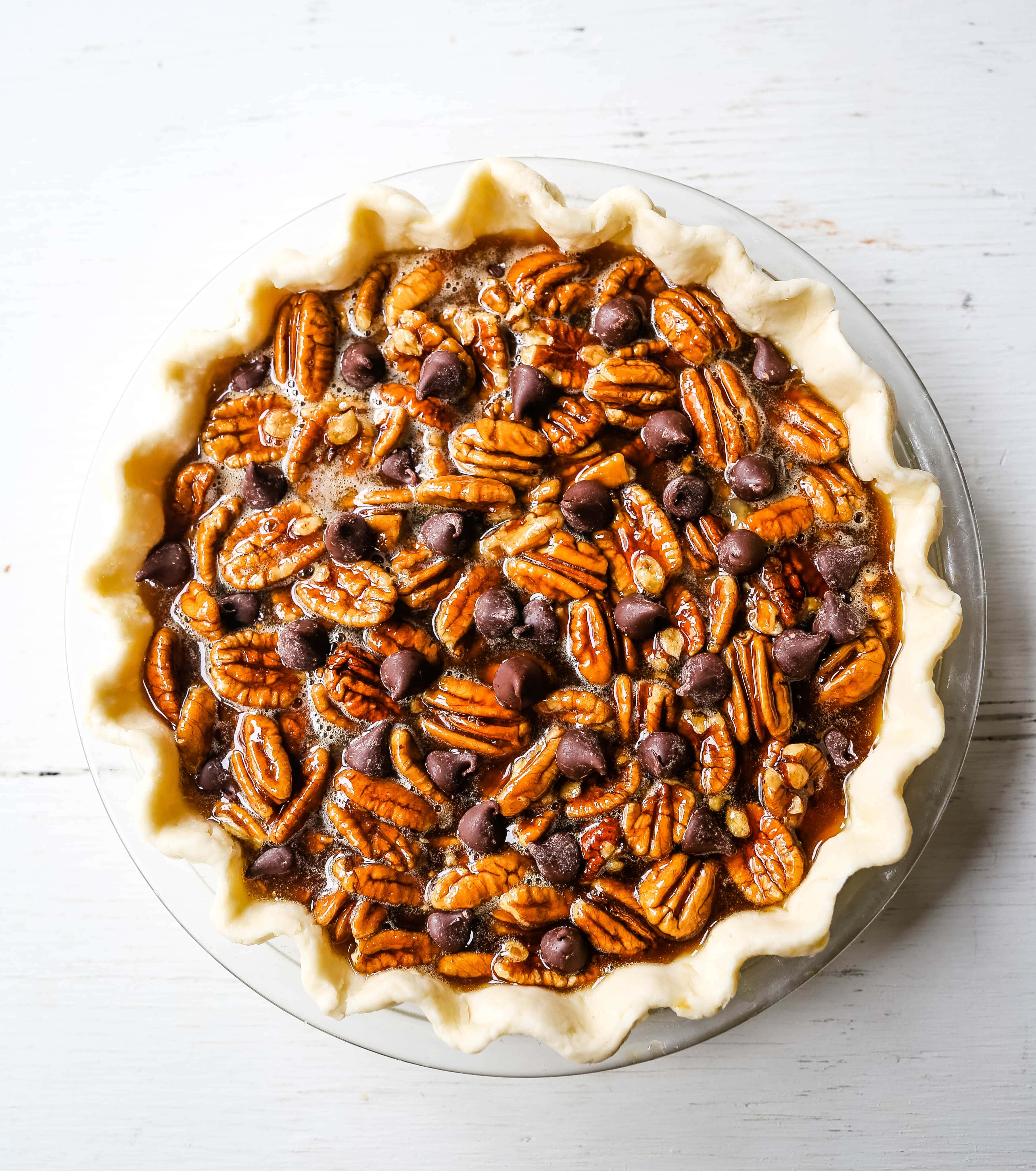 Chocolate Pecan Pie Rich chocolate pecan pie made with a brown sugar filling, crunchy pecans, rich chocolate, all in a homemade buttery, flaky pie crust. www.modernhoney.com #pie #pecanpie #chocolatepecanpie #thanksgiving #pies