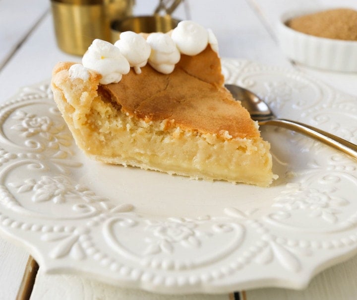 Creme Brûlée Pie. A silky smooth vanilla custard in a buttery crust topped with a crisp sugar topping. It is a creamy sweet pie with a touch of tang and will be everyone's favorite pie! www.modernhoney.com #thanksgiving #pie #pies #thanksgivingrecipes #cremebrulee