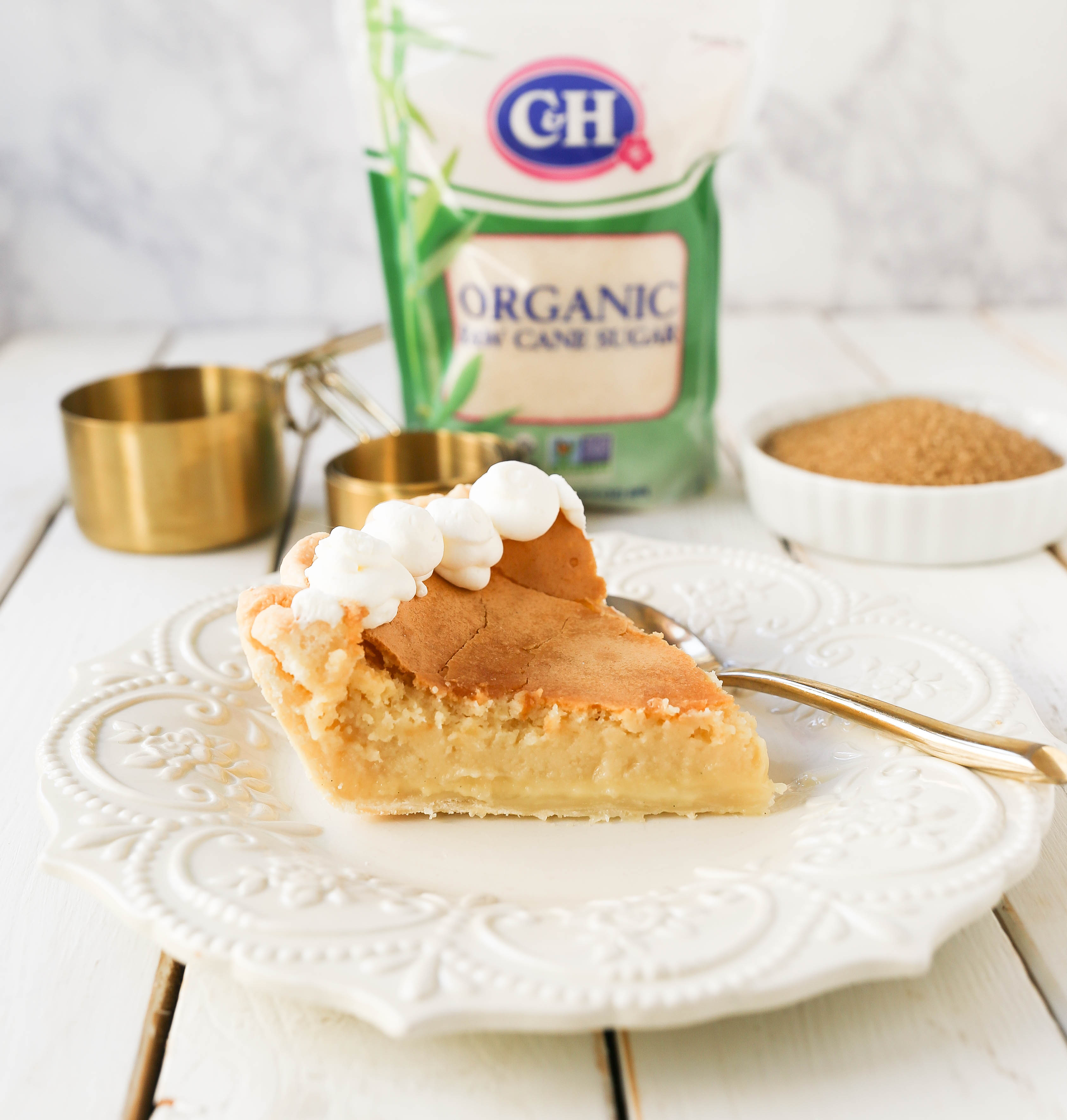 Creme Brûlée Pie. A silky smooth vanilla custard in a buttery crust topped with a crisp sugar topping. It is a creamy sweet pie with a touch of tang and will be everyone's favorite pie! www.modernhoney.com #thanksgiving #pie #pies #thanksgivingrecipes #cremebrulee