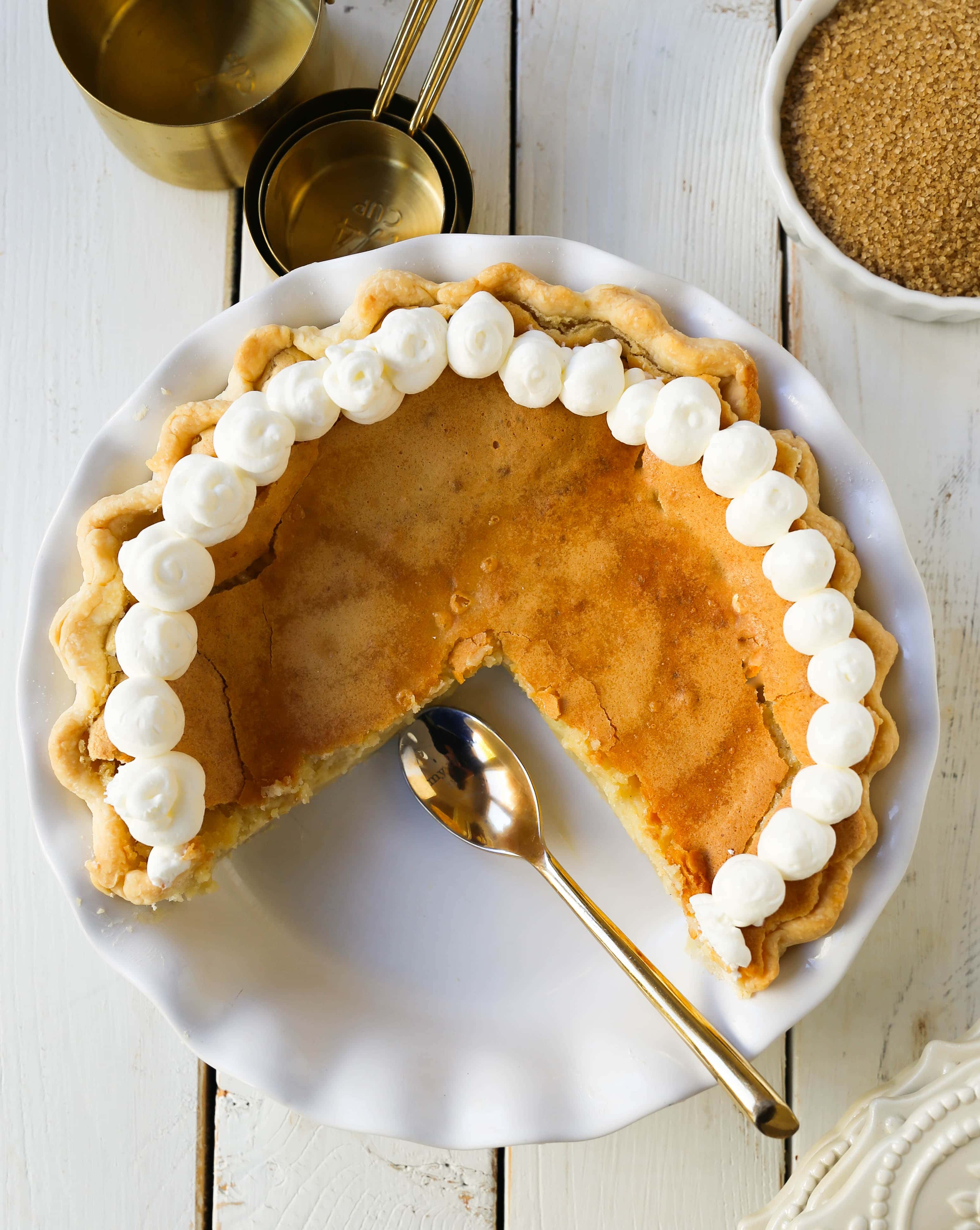 Creme Brûlée Pie. A silky smooth vanilla custard in a buttery crust topped with a crisp sugar topping. It is a creamy sweet pie with a touch of tang and will be everyone's favorite pie! www.modernhoney.com #thanksgiving #pie #pies #thanksgivingrecipes #cremebrulee
