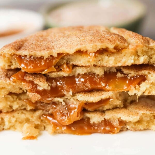 Caramel Filled Snickerdoodle Cookies Soft chewy cinnamon sugar snickerdoodle cookies stuffed with buttery caramel. The perfect caramel stuffed snickerdoodle cookie recipe! www.modernhoney.com #caramelsnickerdoodles #christmascookies #cookie #cookies