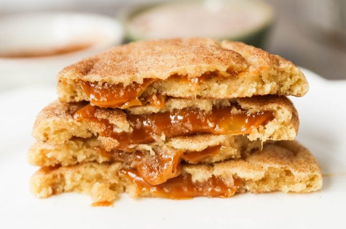 Caramel Filled Snickerdoodle Cookies Soft chewy cinnamon sugar snickerdoodle cookies stuffed with buttery caramel. The perfect caramel stuffed snickerdoodle cookie recipe! www.modernhoney.com #caramelsnickerdoodles #christmascookies #cookie #cookies