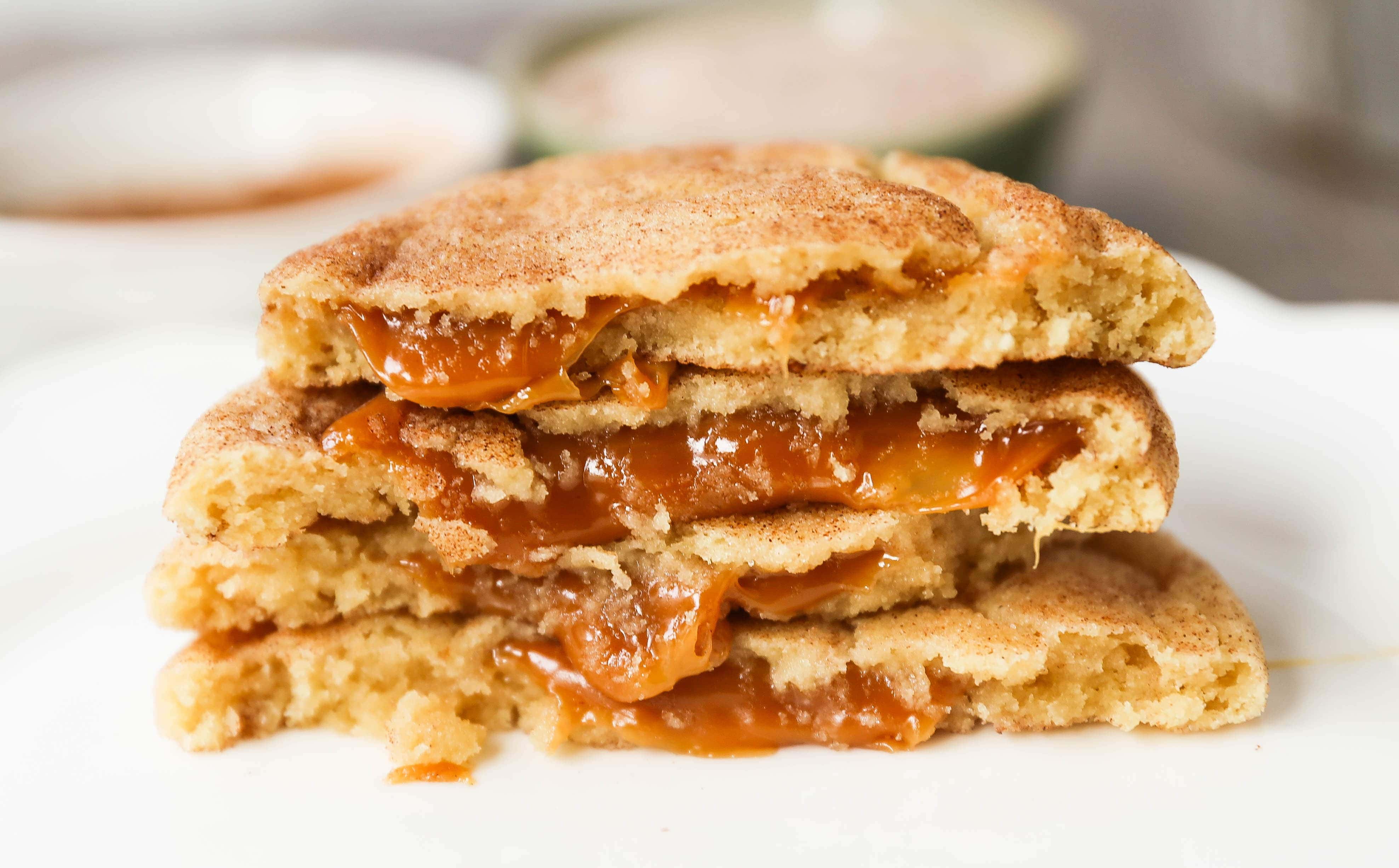 Caramel Filled Snickerdoodle Cookies Soft chewy cinnamon sugar snickerdoodle cookies stuffed with buttery caramel. The perfect caramel stuffed snickerdoodle cookie recipe! www.modernhoney.com #caramelsnickerdoodles #christmascookies #cookie #cookies