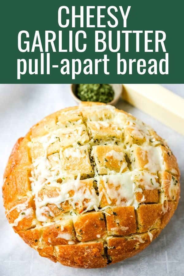 Cheesy Pull-Apart Garlic Bread Warm sourdough bread baked with garlic butter, melted mozzarella cheese, and spices. The best pull-apart garlic cheese bread! www.modernhoney.com #garlicbread #cheesebread #garliccheesebread