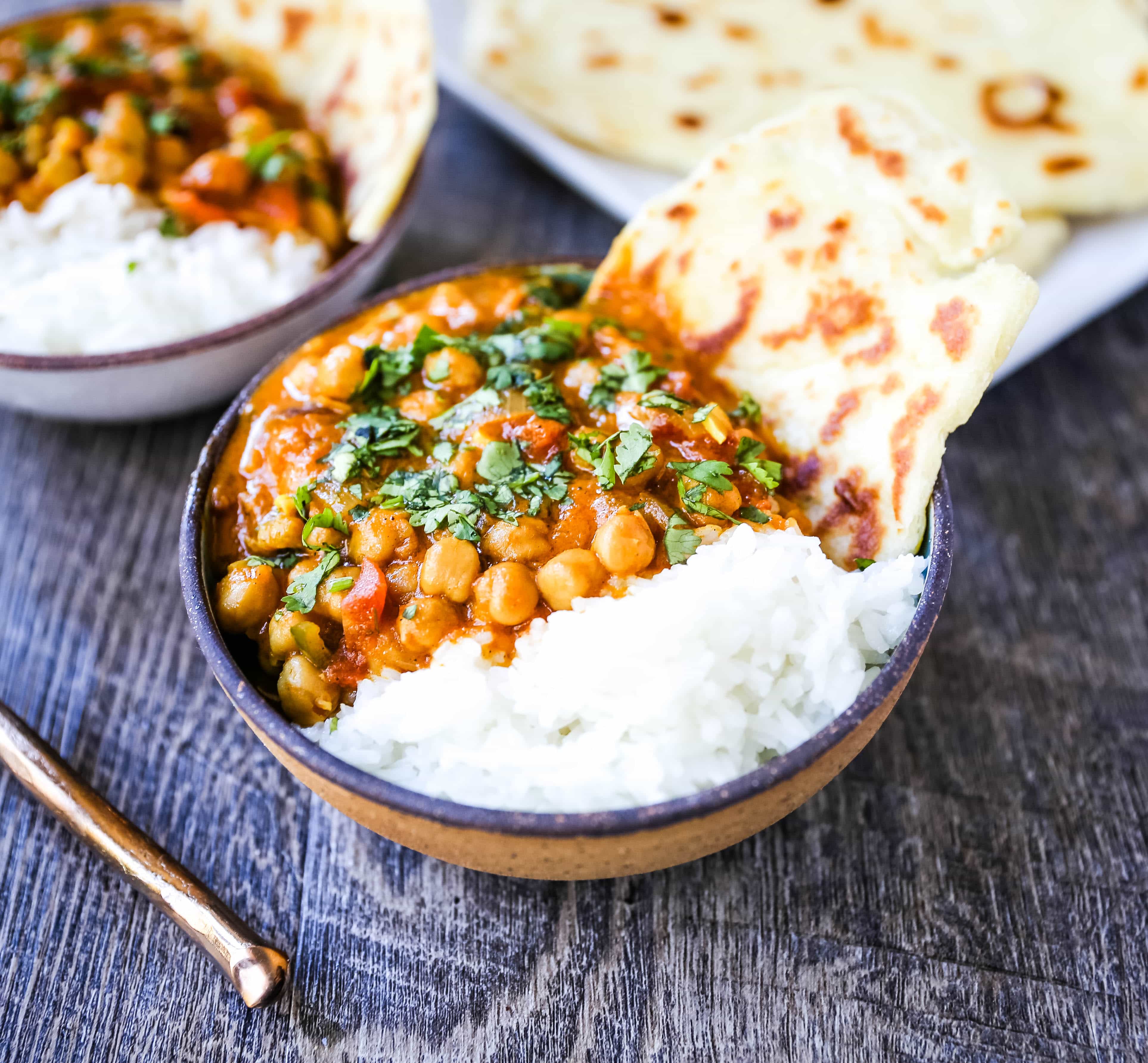 Coconut Chickpea Curry A rich coconut curry broth with onion, garlic, ginger, Indian spices in coconut milk and tossed with chickpeas. Flavorful vegan meal and you won't even miss the meat!  www.modernhoney.com #vegan #curry #indianfood #vegancurry #chickpeacurry