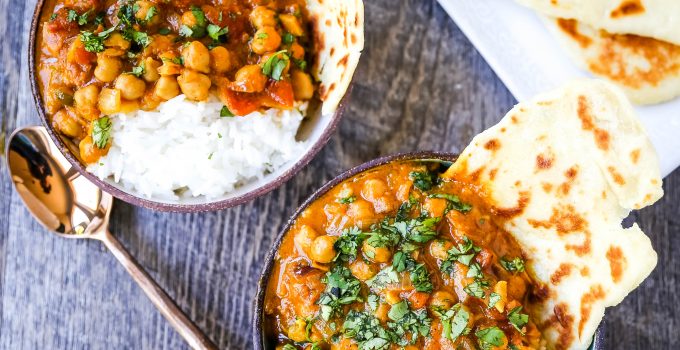 Coconut Chickpea Curry A rich coconut curry broth with onion, garlic, ginger, Indian spices in coconut milk and tossed with chickpeas. Flavorful vegan meal and you won't even miss the meat!  www.modernhoney.com #vegan #curry #indianfood #vegancurry #chickpeacurry