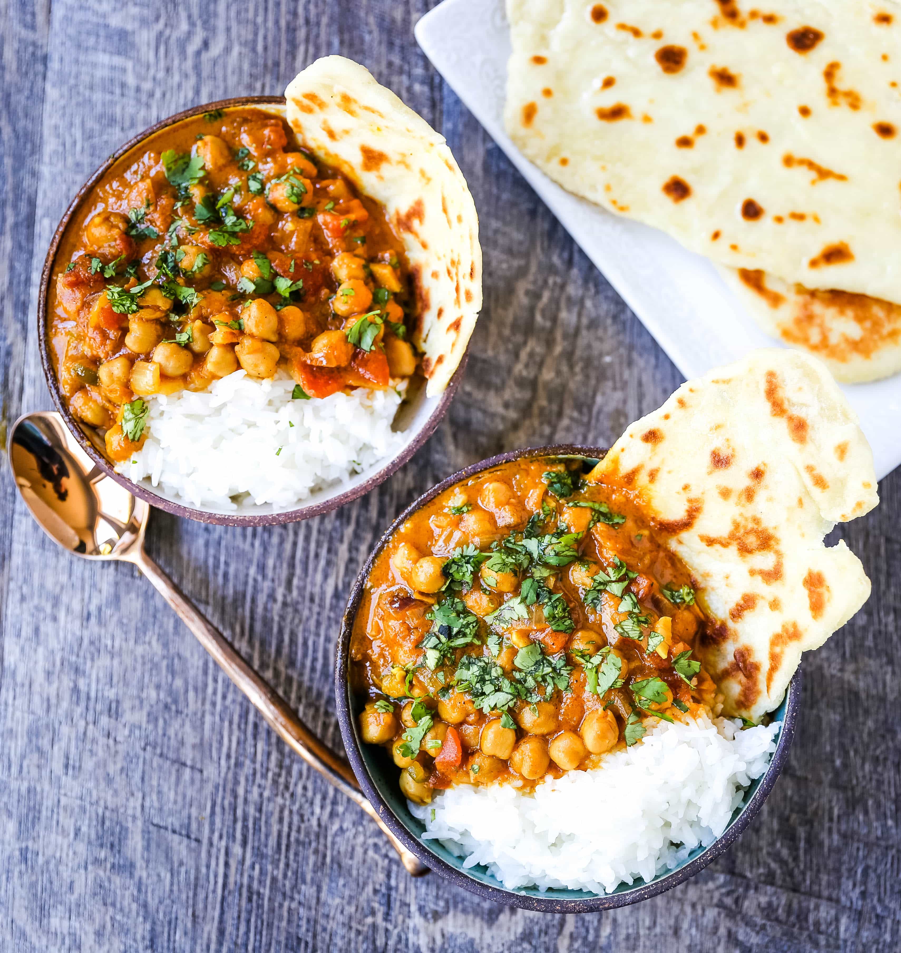 Coconut Chickpea Curry A rich coconut curry broth with onion, garlic, ginger, Indian spices in coconut milk and tossed with chickpeas. Flavorful vegan meal and you won't even miss the meat!  www.modernhoney.com #vegan #curry #indianfood #vegancurry #chickpeacurry