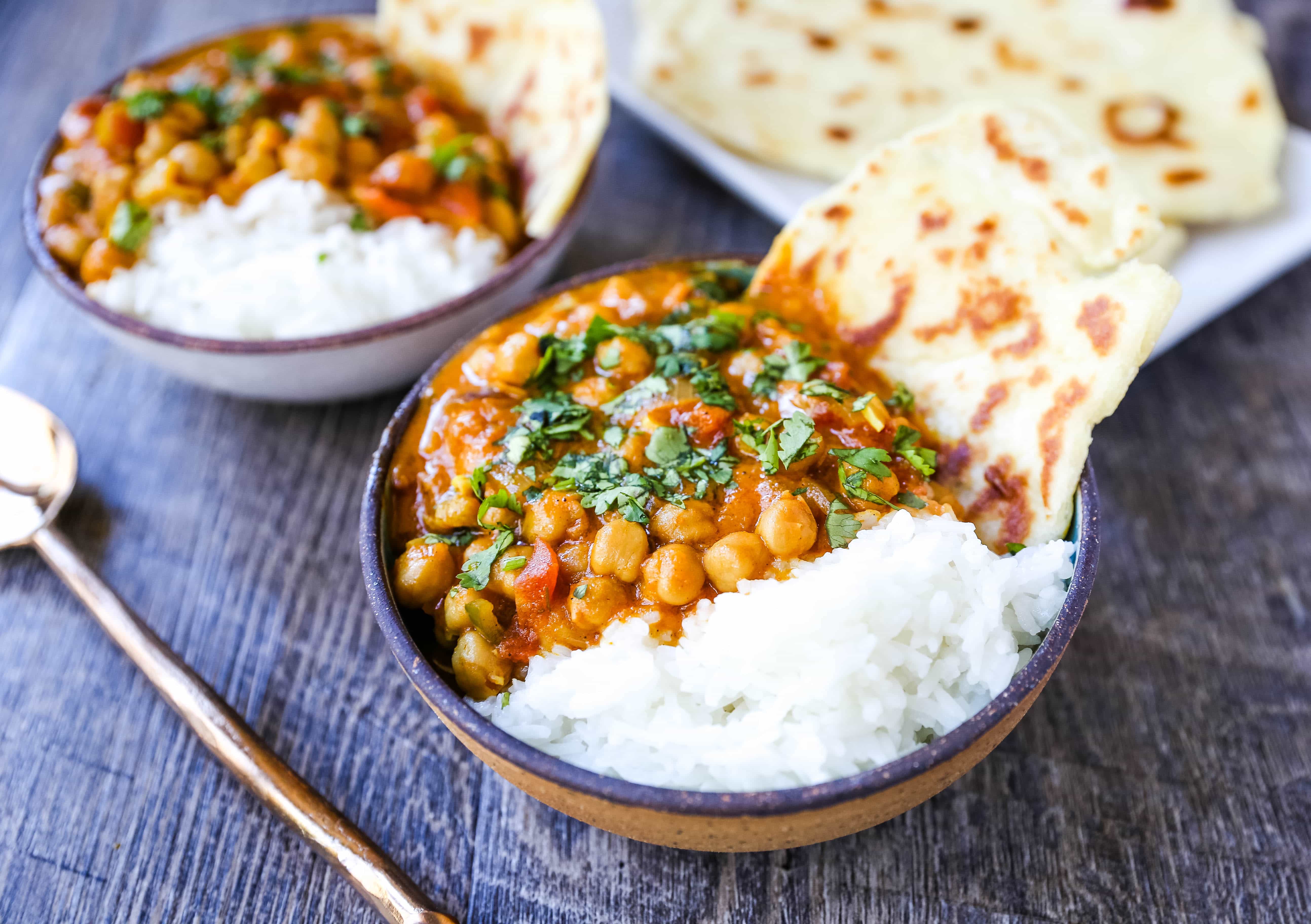 Coconut Chickpea Curry A rich coconut curry broth with onion, garlic, ginger, Indian spices in coconut milk and tossed with chickpeas. Flavorful vegan meal and you won't even miss the meat!  www.modernhoney.com #vegan #curry #indianfood #vegancurry #chickpeacurry