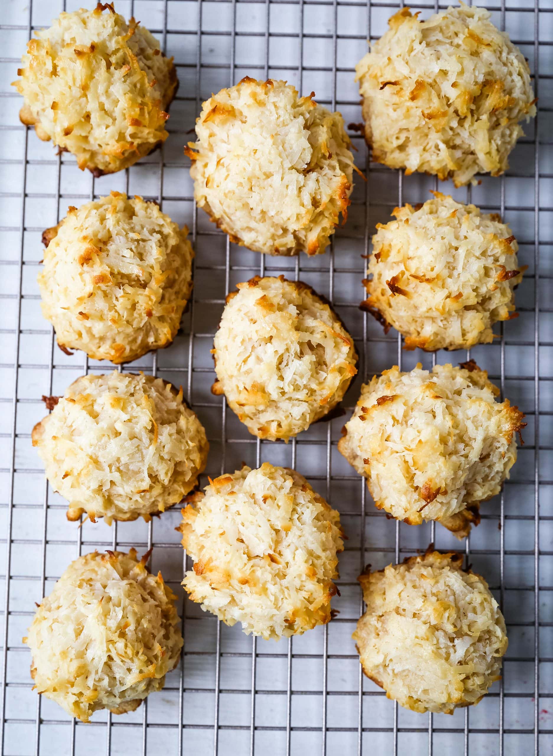 The Best Coconut Macaroons. Soft chewy sweet coconut macaroons are the perfect gluten-free cookie. How to make the perfect coconut macaroons dipped in dark chocolate. www.modernhoney.com #macaroons #coconutmacaroons #macaroon #christmascookie #christmascookies