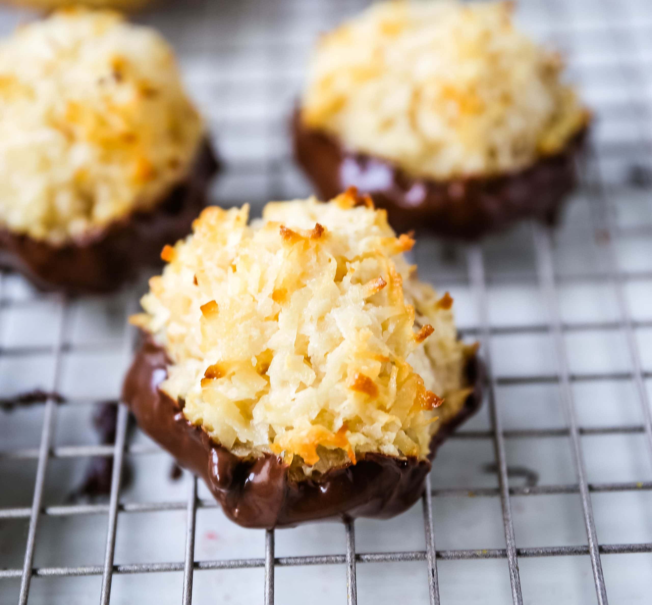 The Best Coconut Macaroons. Soft chewy sweet coconut macaroons are the perfect gluten-free cookie. How to make the perfect coconut macaroons dipped in dark chocolate. www.modernhoney.com #macaroons #coconutmacaroons #macaroon #christmascookie #christmascookies