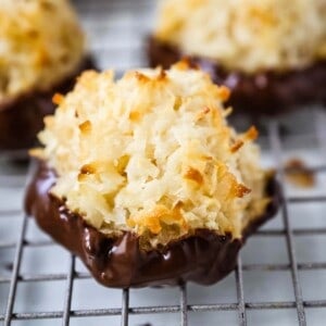 The Best Coconut Macaroons. Soft chewy sweet coconut macaroons are the perfect gluten-free cookie. How to make the perfect coconut macaroons dipped in dark chocolate. www.modernhoney.com #macaroons #coconutmacaroons #macaroon #christmascookie #christmascookies