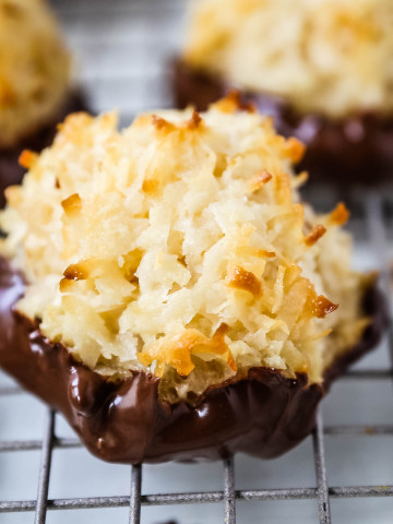 The Best Coconut Macaroons. Soft chewy sweet coconut macaroons are the perfect gluten-free cookie. How to make the perfect coconut macaroons dipped in dark chocolate. www.modernhoney.com #macaroons #coconutmacaroons #macaroon #christmascookie #christmascookies