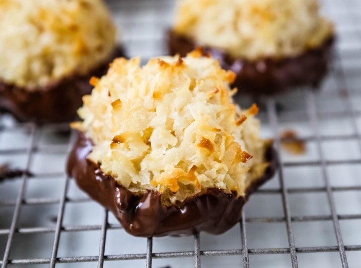 The Best Coconut Macaroons. Soft chewy sweet coconut macaroons are the perfect gluten-free cookie. How to make the perfect coconut macaroons dipped in dark chocolate. www.modernhoney.com #macaroons #coconutmacaroons #macaroon #christmascookie #christmascookies